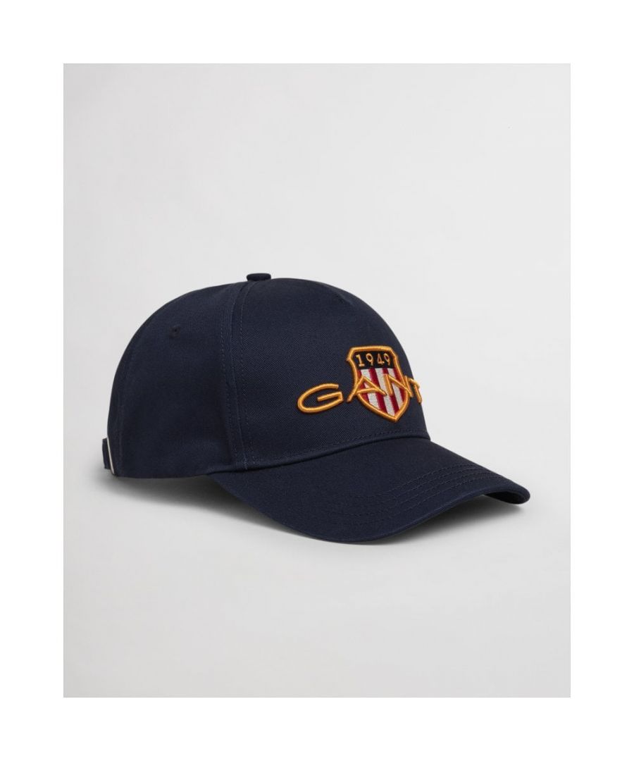 This take on our GANT shield first appeared in the '80s, and we've revamped it and brought it back to add vintage cool to any outfit. This cotton cap features the Archive Shield logo in raised embroidery with gold thread detail and adds a preppy edge to any spring outfit. 100% Cotton.