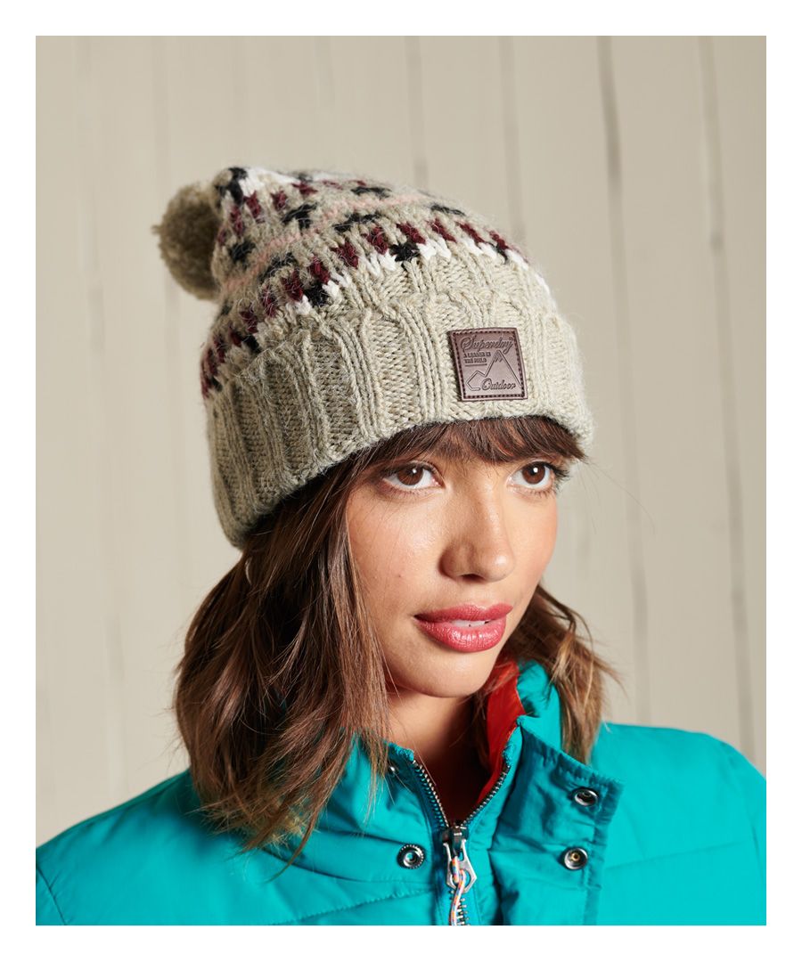 Keep warm this season with the Intarsia beanie. An essential when it comes to the colder months, this beanie features an all-over Nordic-inspired design to bring out your distinctive style.All-over patternRolled hemBobbleSignature logo badge