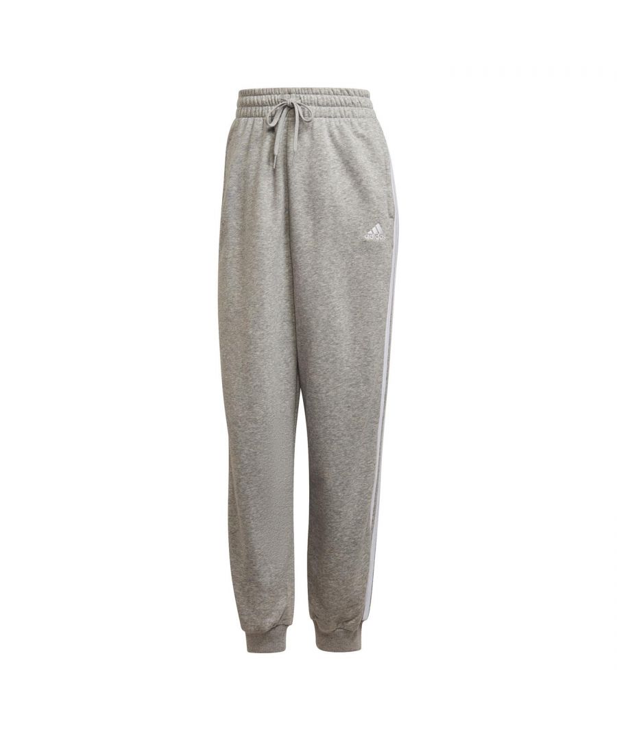 adidas Lounge Jogging Pants Womens - These adidas Lounge Jogging Pants are crafted with an elasticated waistband and drawstring adjustment for a secure fit. They feature comfortable ribbed cuffs as well as two hand pockets for a classic look and are a lightweight construction. These joggers are designed with a signature logo and are complete with adidas branding.