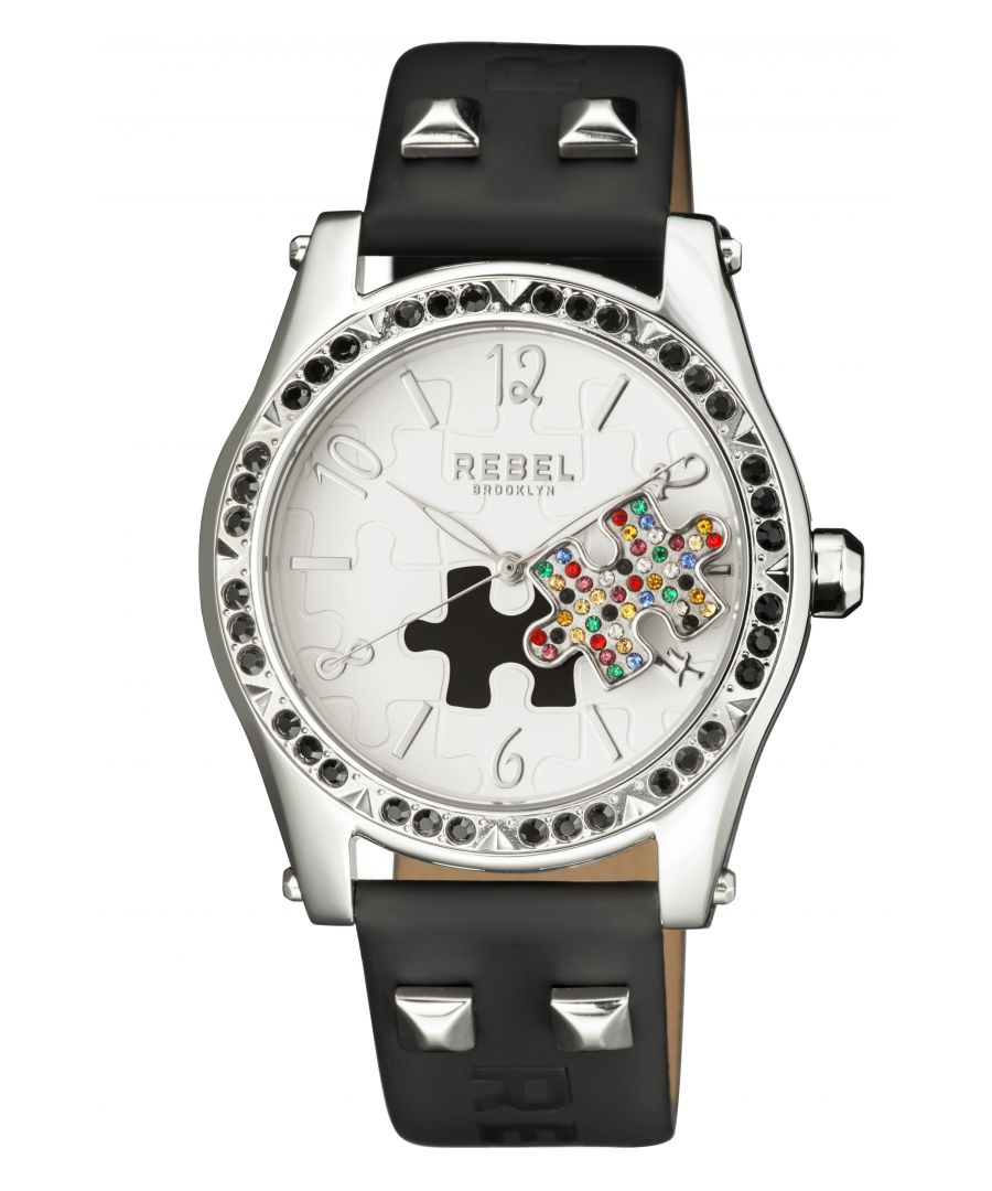 “   you little rebel, I like you.”           This line, which is quoted on the caseback of the watch, is the essence of the Gravesend collection. The studded puzzle piece standing out of the dial face is unconventional. The perfectly matching dial color, bezel crystals and band leather all come together to help bring out that unique personality and attitude that we all want to be.Rebel Gravesend White Dial Women's Watch RB111-4021\nRebel Women's Watch from the Gravesend Collection\nRound 316L Stainless Steel Silver Case\nWhite Dial, Mineral Crystal w/ Sapphire Coating\nBlack Leather Band with Tang Buckle\nWater Resistance: 5 ATM (50 meters, 165 feet)\n12mm Case Thickness, 40mm Case Diameter, 20mm Band Width\nQuartz Movement