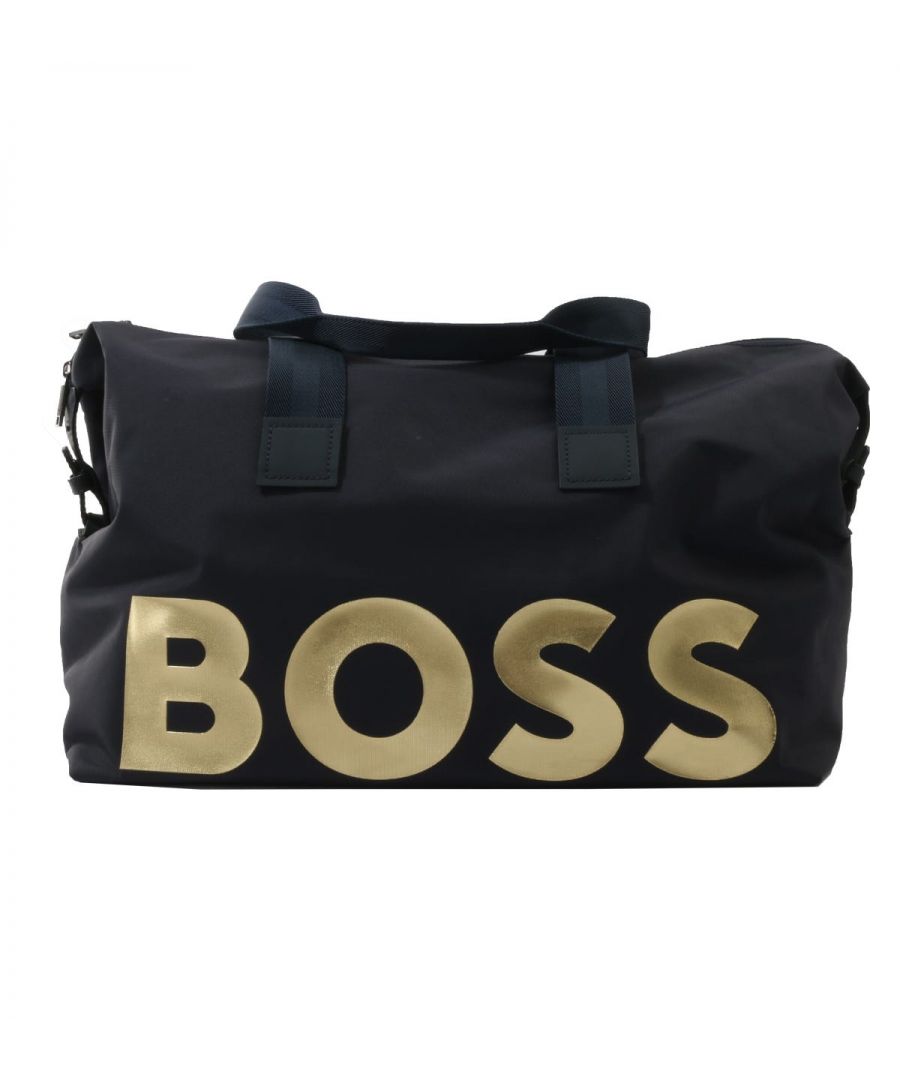 A stylish companion for your travels, the Contrast Logo Holdall Bag from BOSS has all the room for your traveling essentials. Crafted from recycled nylon providing sustainable durability without compromising on style. Featuring one main zip compartment with internal pockets for easy storage, twin carrying handles, a detachable shoulder strap and snap adjusters to the exterior. Finished with a contrast BOSS logo to the front.Recycled Nylon, Main Zip Compartment, Interior Zip & Open Pockets, Webbing Carrying Handles, Detachable Adjustable Webbing Shoulder Strap, Dimensions: 48.5 x 30 x 25cm, BOSS Branding.