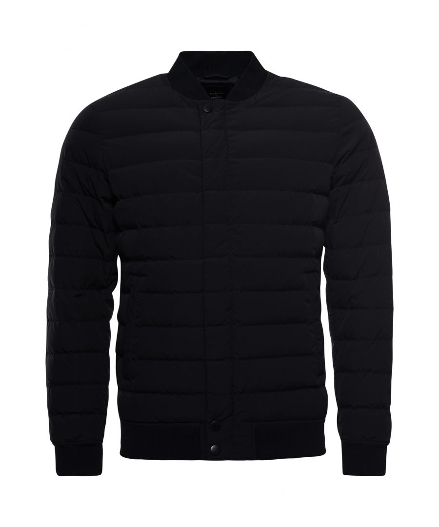 A great transitional piece, this bomber jacket is lightweight and has a 90/10 down padding to help keep you warm.Slim fit – designed to fit closer to the body for a more tailored look90/10 Down paddingMain zip and popper fasteningThree pocket design including one inner pocketRibbed collar, cuffs and hemSignature logo badgeSuperdry is certified by the Responsible Down Standard to confirm that our down filled products are sourced to ensure animal welfare.