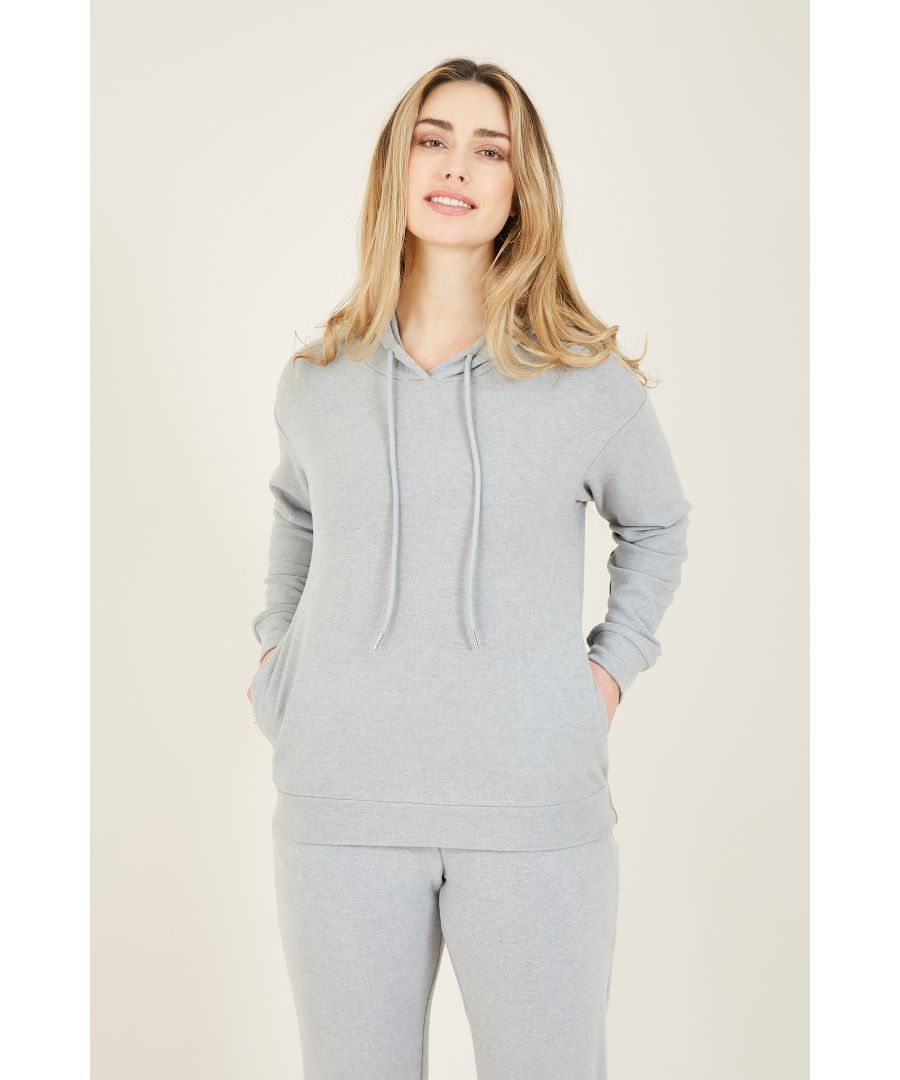 Love to lounge? Look to our Yumi Velour Loungewear Hoodie as the perfect piece for your staples collection. In a light shape with plenty of movement, this hoodie is designed with a drawstring neckline, long sleeves, and a nifty hood. On the front, a pocket has been added, perfect for when you head outside (or when your hands are cold). The supersoft velour fabric adds a touch of luxury to your look, whilst the neutral tones allows you to pair it with any piece in your wardrobe.  70% Viscose 20% Polyester 5% Elastane Machine Wash At 30
