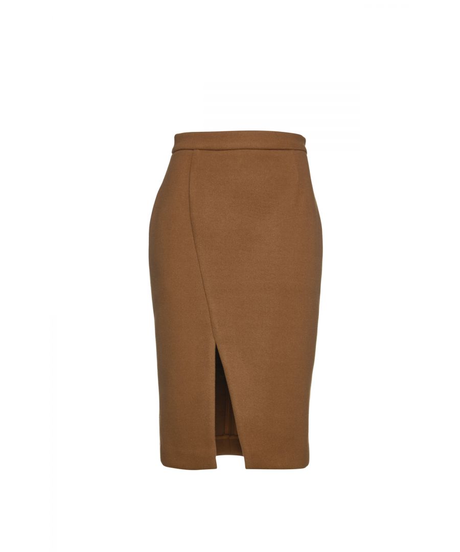 This camel winter pencil skirt is crafted in faux mouflon style coat fabric. It has a 4cm wide waistband in the same fabric with darts below in the back. There is an off-centre slit in the front. It fastens in the back with a concealed zip. This pencil skirt is knee length and fully lined. Wear with a fitted jersey top or, for a more formal office look, with a blouse and jacket. Heels and an off-shoulder top will take this skirt and you for a night on the town!