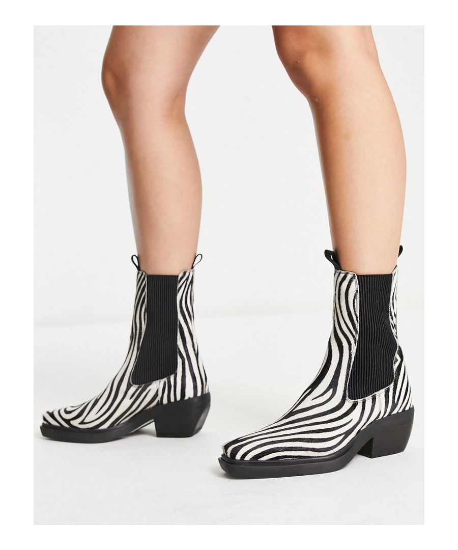 Boots by ASOS DESIGN This season's main character Pull tabs for easy entry Elasticated inserts Almond toe Low block heel Sold by Asos