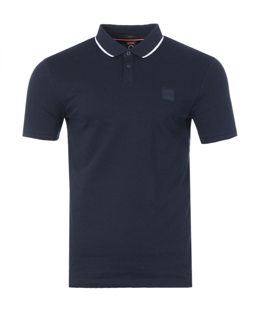 A classic BOSS polo shirt in a defined slim fit, crafted from sustainably sourced made in Africa cotton pique with added stretch ensuring day long comfort and a super soft feel. Featuring a ribbed polo collar, a two-button placket, short sleeves with ribbed cuffs and contrast stripe tipped detailing. Finished with the signature BOSS logo patch at the chest.Cotton made in Africa - an initiative of the Aid by Trade Foundation, one of the world\'s leading standards for sustainably produced cotton.Slim Fit, Sustainably Sourced Stretch Cotton Pique, Ribbed Polo Collar, Two Button Placket, Short Sleeves with Ribbed Ruffs, Contrast Stripe Tipping, BOSS Branding. Style & Fit:Slim Fit, Fits True to Size. Composition & Care:97% Cotton, 3% Elastane, Machine Wash.