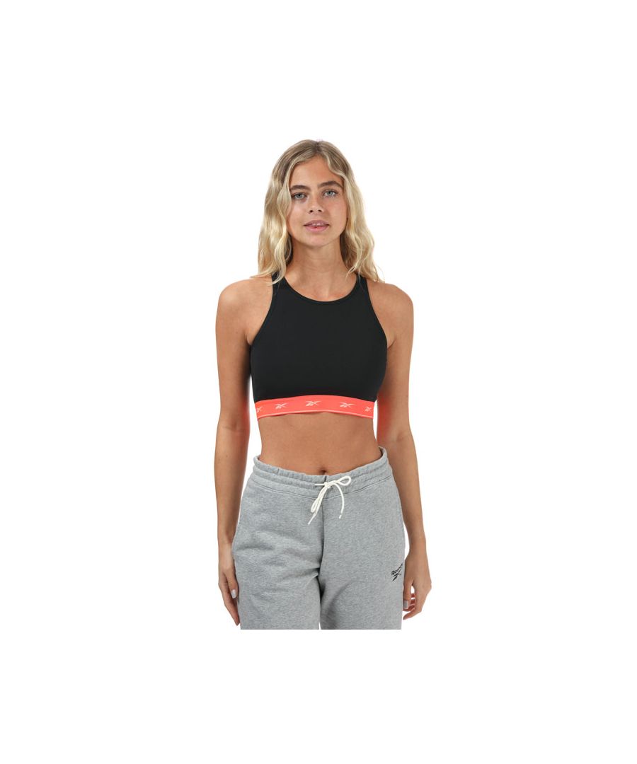 Womens Reebok Beyond The Sweat Crop Top in black.- Round neckline.- Sleeveless.- Elastic hem.- Doubleknit.- Repeating Vector logo on the elastic underband.- Fitted fit.- Shell: 84% Polyester  16% Elastane. Inner Lining: 94% Polyester  6% Elastane. Machine washable.- Ref: GU8276