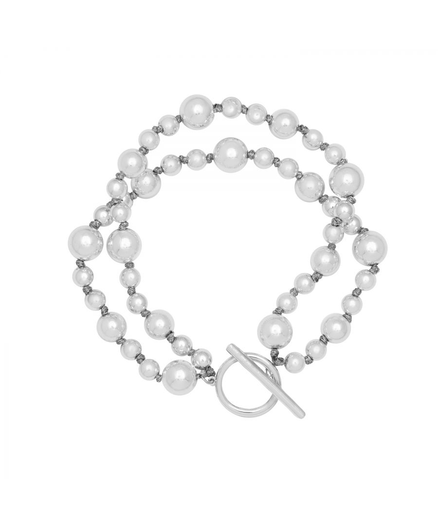 Our Silver plated Artisan Ball bracelet is simple and glamorous! An elegant silver ball bracelet comprising of two layers of shiny balls that will adds a touch of glamour to your look. Pair with the matching necklace and earrings for a complete set. Measuring 19.5cm in length with a modern hoop and bar fastening.