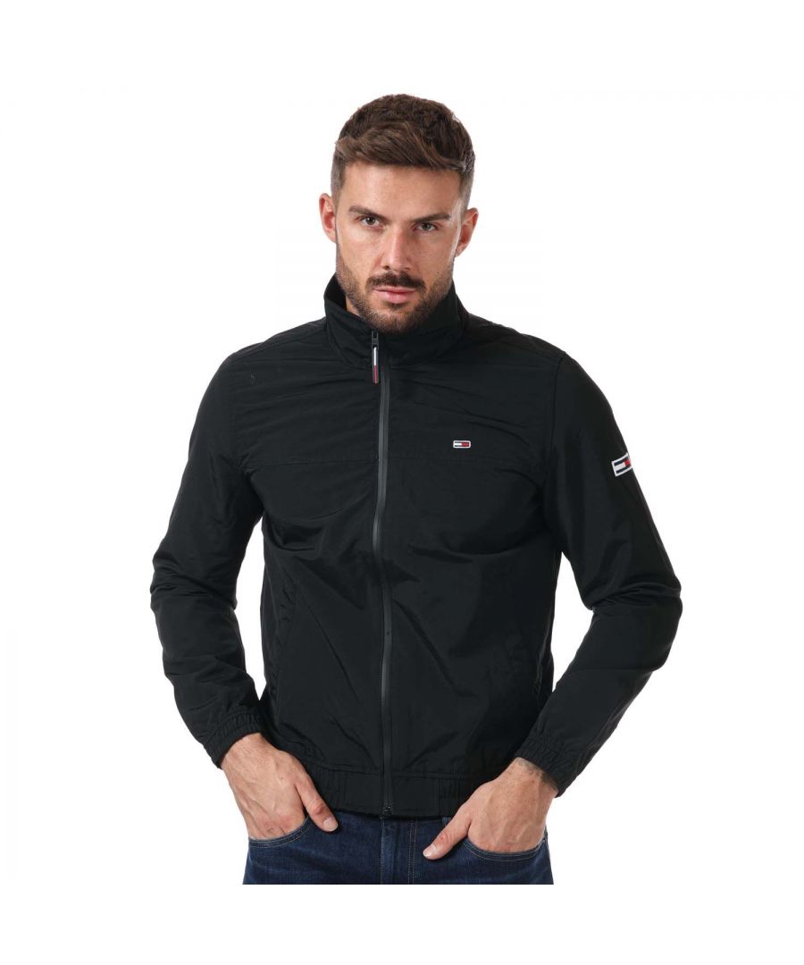 Mens Tommy Hilfiger Seasonal Bomber Jacket in black.- Funnel neck.- Full zip fastening.- Buttoned pockets.- Mesh lining.- Elasticated cuffs and hem.- Embroidered logo on chest and sleeve.- Insulated.- Regular fit.- Shell: 100% Polyamide.- Ref: DM0DM12303BDS
