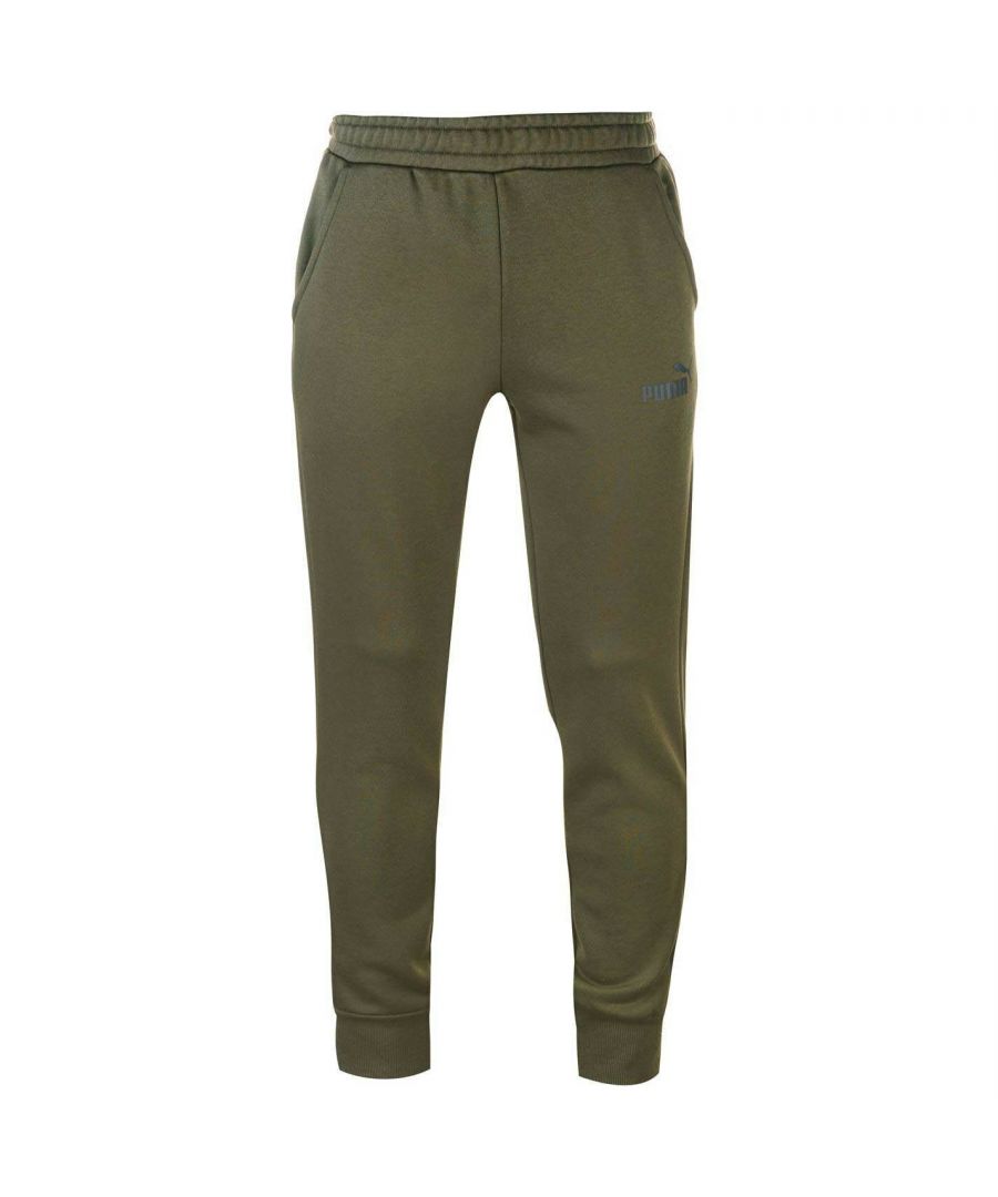 The Puma Essential Logo Mens Sweat Pants are designed for both fashion and fitness as they offer great comfort and warmth, ideal for wearing during the colder periods. The tapered leg offers freedom of movement, whilst the dual hip pockets allow you to store your valuables safely. The elastic waistband with inner drawcord gives you both superb comfort and an adjustable fit. Finished off with the iconic Puma Cat Logo to the left thigh, helping to maintain that well known appearance.