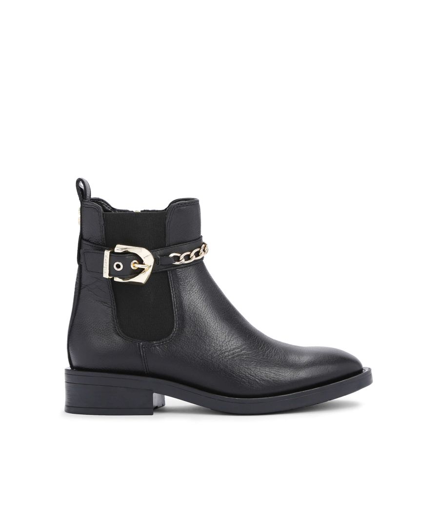 The Rider ankle boot features a black leather upper. The ankle features a golden chain detail as well as golden faceted buckle. This style features ‘All Day Long’ technology. Golden Icon C stud at the back of the ankle.