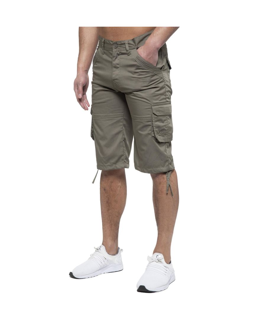 Enzo Mens Cargo Combat Jeans. 7 Pocket Design Including Single Coin Pocket. 2 Front Slash Pockets with Extra Fabric Stitching Detail. 2 Side Cargo Pockets, 2 Back Bellow Pockets with Velcro Fastening Flap. Extra Stitching Details to all Pockets. Adjustable Drawstring to the Hems. Zip Fly Fastening. Premium Quality Fabric Ideal for Casual and Heavy Duty Work Wear.