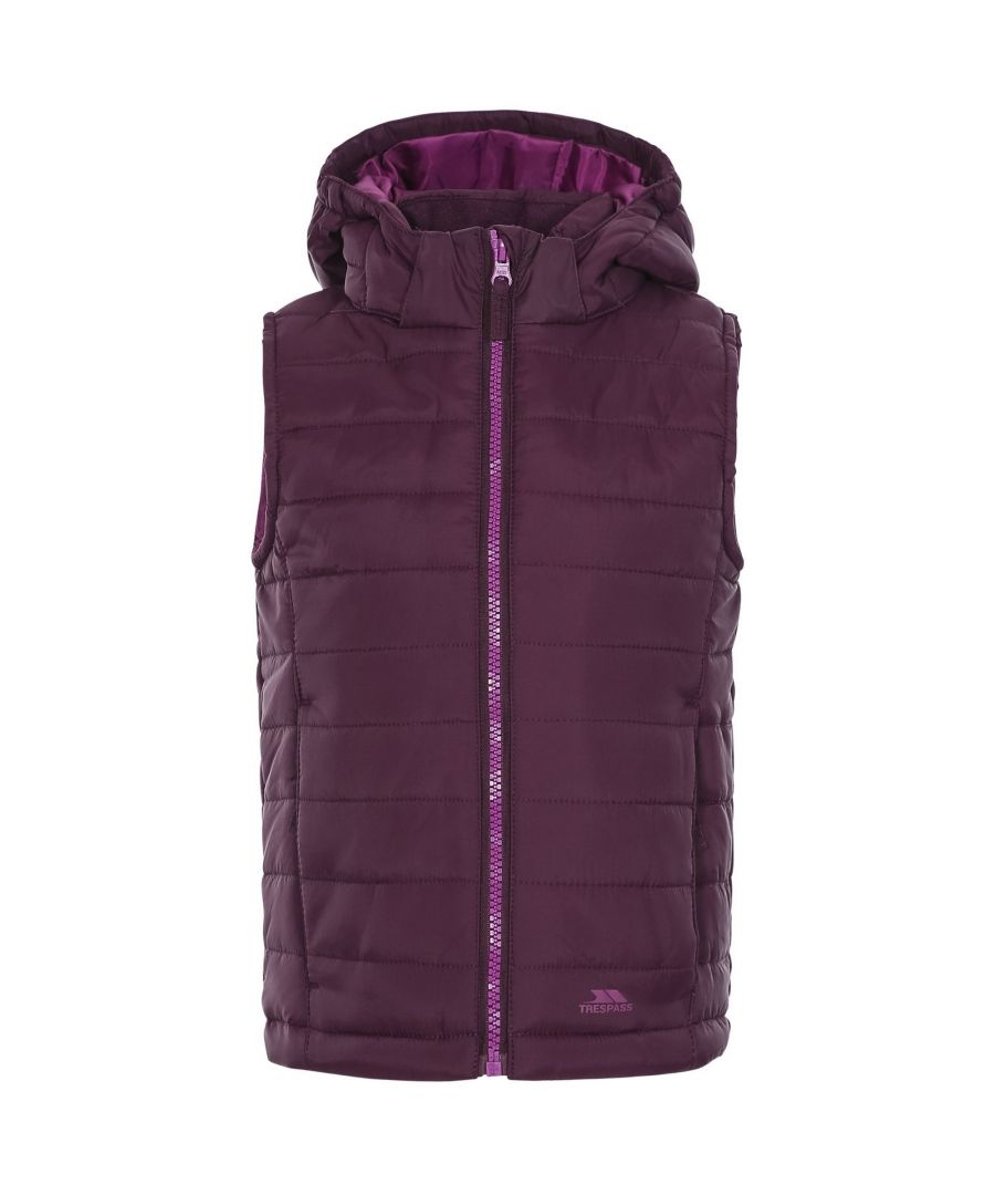 Girls casual gilet with detachable hood. Lightly padded with bubble stitching. Contrast lining and front zip. Inner storm flap. Hem adjusters. 2 x low profile zip pockets. Detachable hood with stud fastening. Ideal for wearing outside on a cold day. Shell: 100% Polyamide AC Coating. Lining: 100% Polyester. Filling: 100% Polyester.