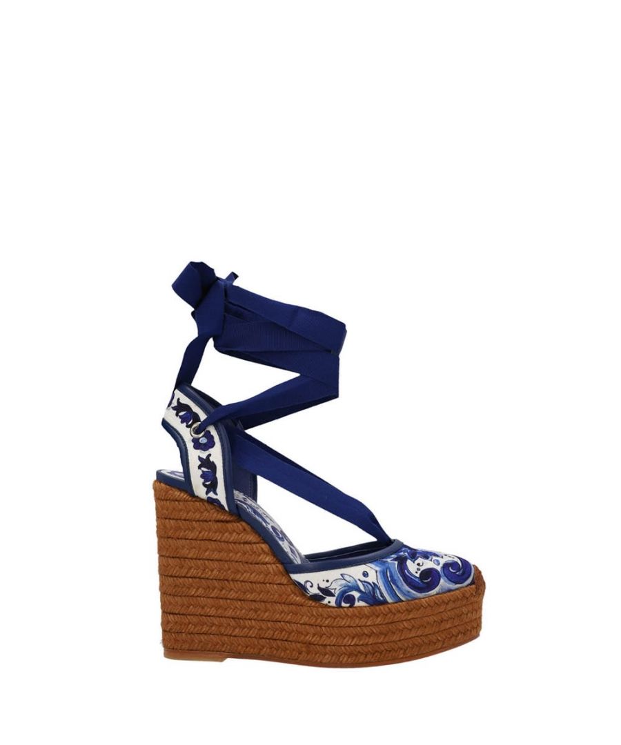 'Blu Mediterraneo' wedges featuring a woven rope bottom, crafted in soft majolica-print brocade fabric, trimmed in nappa leather, grosgrain ribbon, hollow wedge, printed kidskin insole with a logo label, woven rope bottom, logo rubber sole.
