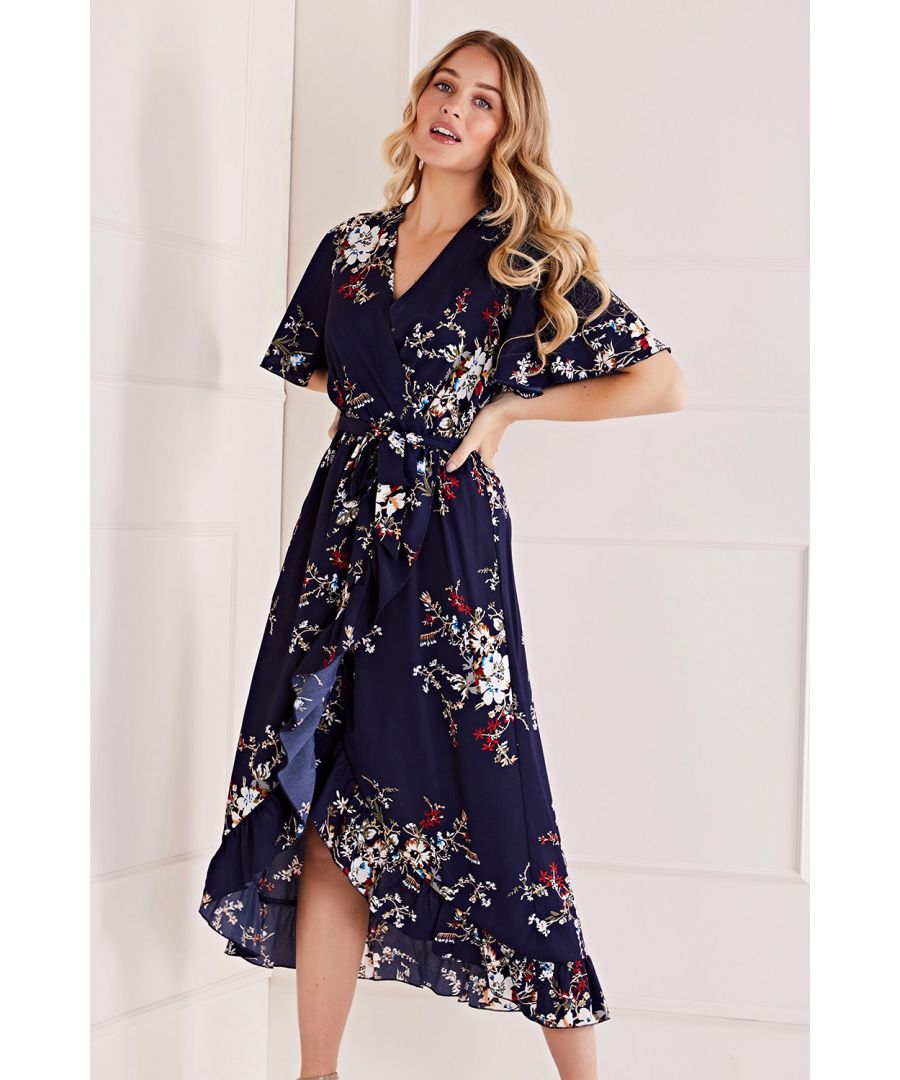 This Mela Floral Dipped Hem Maxi Dress provides a versatile option for your everyday edit. Designed in a wrap shape that flows below the knee, it has a frill trim and short sleeves that flow in a relaxed shape. complete with a tie on the waistline and a bright floral print, update your look with heeled boots or stilettos.