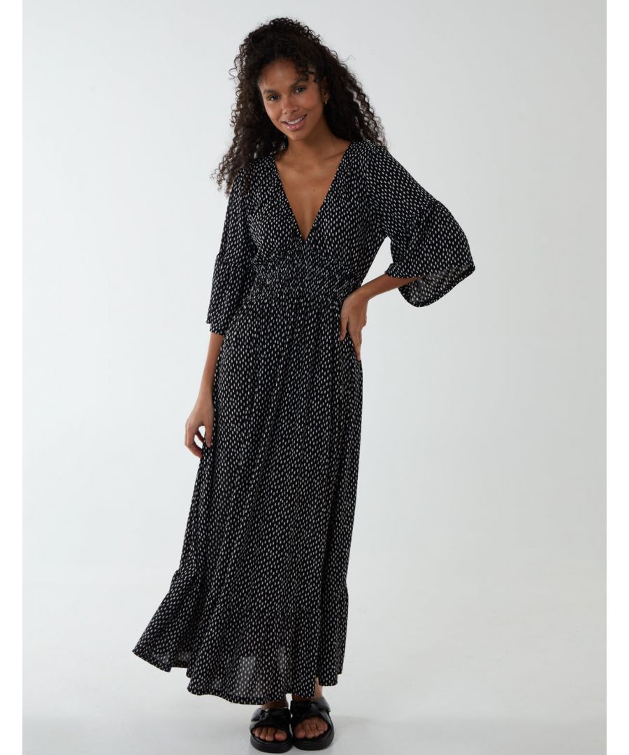 A wardrobe stunner, this wrap maxi dress is perfect when you want to feel comfy. With a dot print and oversized fit nothing can go wrong. Accessorize with sandals for off duty look.