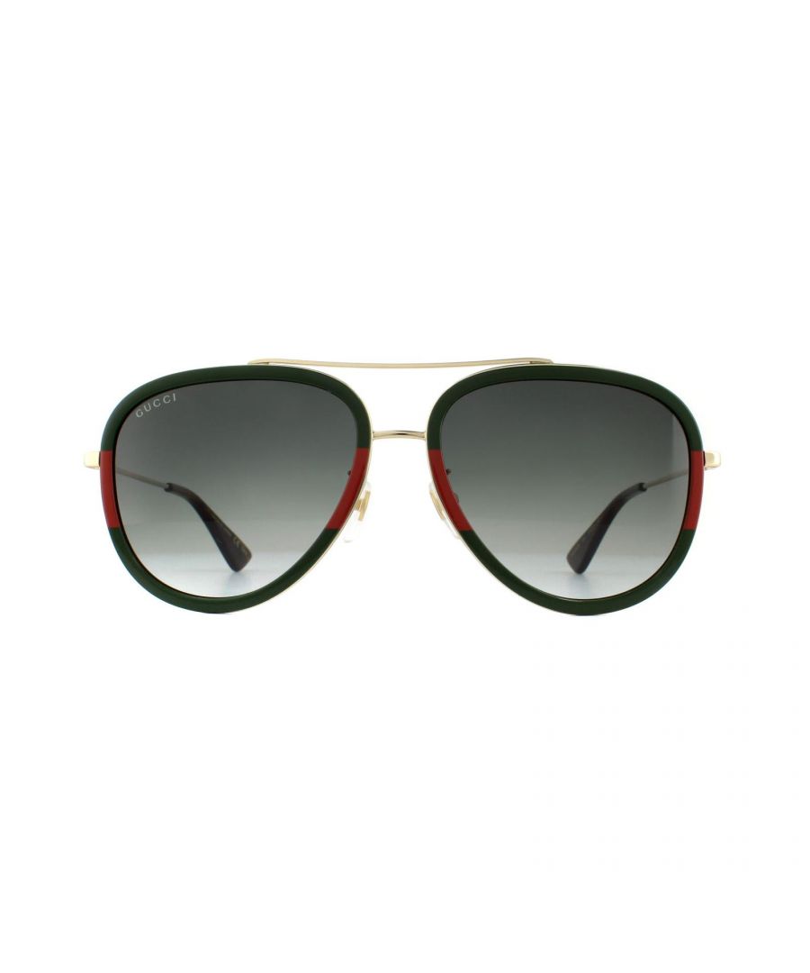 Gucci Sunglasses GG0062S 003 Gold Green Red Green Gradient are a super contemporary version of the classic aviator. The frame front and temple tips are crafted from acetate, and the temples, bridge and brow bar are made from metal, creating a cool contrast. Adjustable nose pads ensure the GG0062s have a personalised fit. Subtle branding can be found on the temples where the GG logo has been incorporated into the temple design.