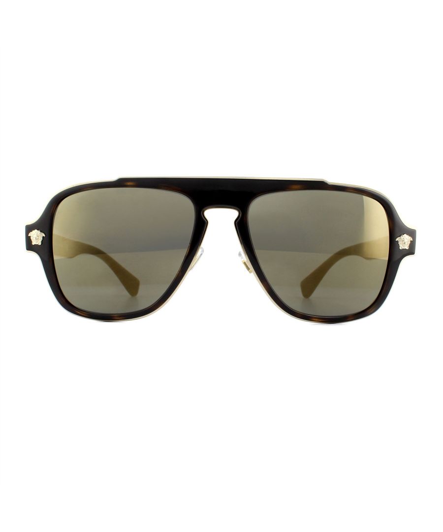 Versace Sunglasses VE2199 12524T Dark Havana Dark Grey Mirror Gold are square shaped aviator style sunglasses. The flat frame front features a metal outer edge and iconic Medusa head logos on each of the corners. The acetate temples showcase the Versace text logo too. Adjustable nose pads ensure a comfortable fit and the keyhole bridge provides a distinctive look.