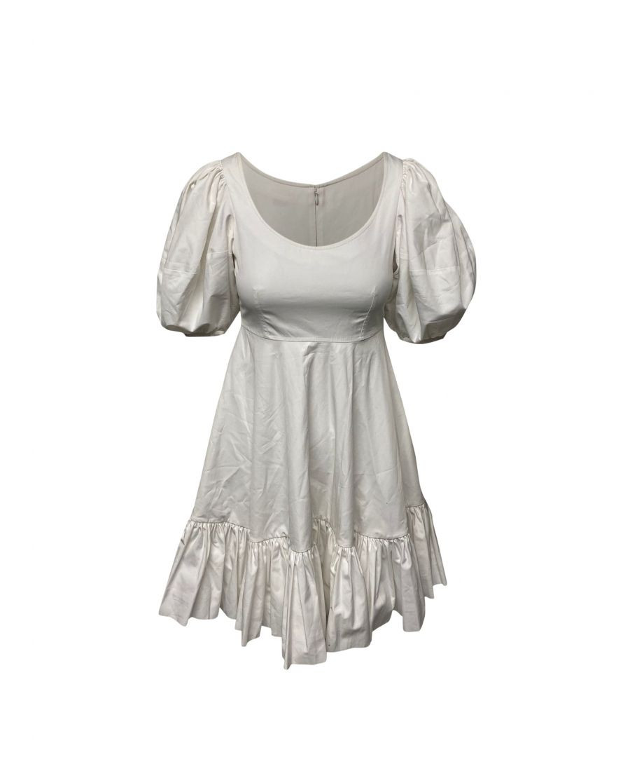 VINTAGE. RRP AS NEW. Oversized puffed sleeves continue to trend as we head toward 2020. Alexander McQueen's pure white dress has been made in Italy from airy cotton-poplin - which holds the structured shape so well - and falls to a tiered, ruffled hem. Take a tip from the brand and cinch it at the waist with a chunky black belt.\n\nAlexander McQueen Tiered Poplin Dress In White Cotton\nCondition: very good, with moderate stains at the arm and collar\nColor: white\nMaterial: Cotton\nSize: IT38/XXS/UK6/FR34\nSign of wear: No\nSKU: 92188