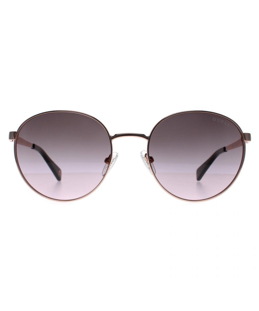Guess Round Unisex Shiny Dark Nickeltin Brown Gradient GU5214  Sunglasses is crafted from high-quality metal, which is both lightweight and durable. The frame features a aviator shape with a double bridge, giving it a unique and fashionable look. The temples are adorned with the Guess logo, adding an extra touch of elegance to the design.