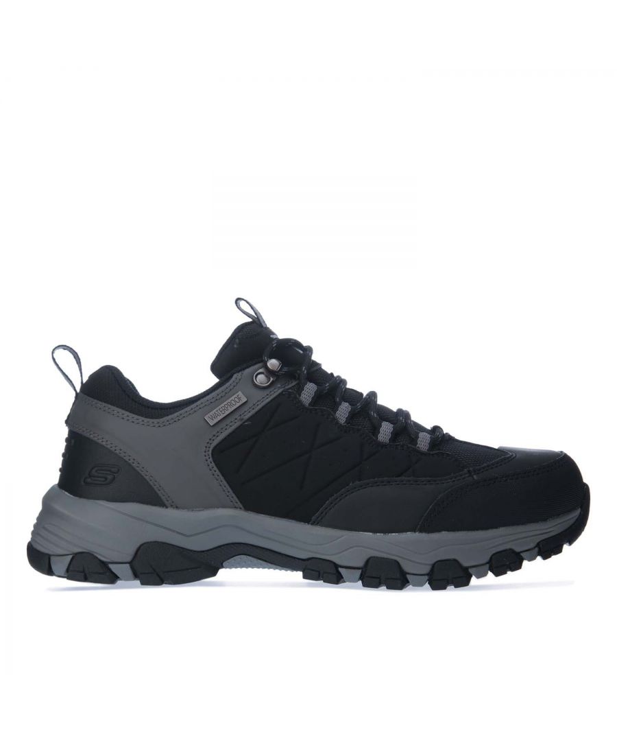 Mens Skechers Selmen Helson Waterproof Walking Shoe in black.- Smooth durable action leather upper.- Lace up front with metal top eyelet.- Smooth nylon mesh fabric panels at front  instep and collar.- Stitching accents.- Waterproof seam sealed design.- Fabric heel and tongue pull on loops.- Synthetic toe and heel bumper overlays.- Front  side and heel leather overlay detail with stitched edging trim.- Side leather panels with embossed detail and perforation accents.- SKECHERS logo detail on tongue.- Relaxed Fit® design for roomy comfortable fit.- Air Cooled Memory Foam full length cushioned comfort insole.- Shock absorbing midsole.- Rubber toe bumper front.- Leather upper  Textile Lining  Synthetic Sole.- Ref: 66282BLK
