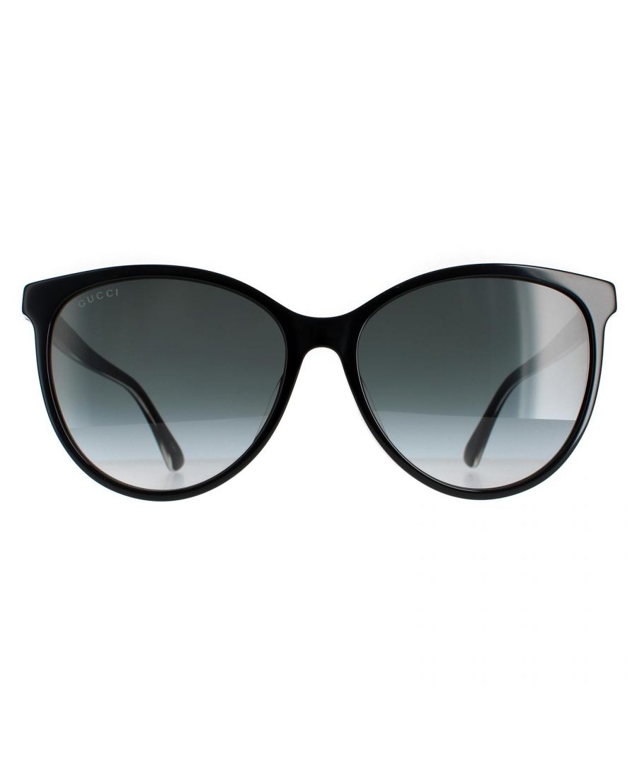 Gucci Round Womens Black Grey Gradient GG0377SKN Sunglasses are a round style with large lenses and feminine corner flicks. Gucci coloured stripes and metal interlocking GG logo embellish the temples.
