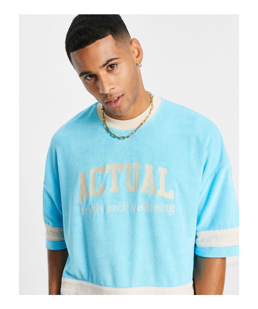 T-shirt by ASOS DESIGN Par of a co-ord set Shorts sold separately Cut-and-sew design Crew neck Logo print to chest Oversized fit Sold by Asos