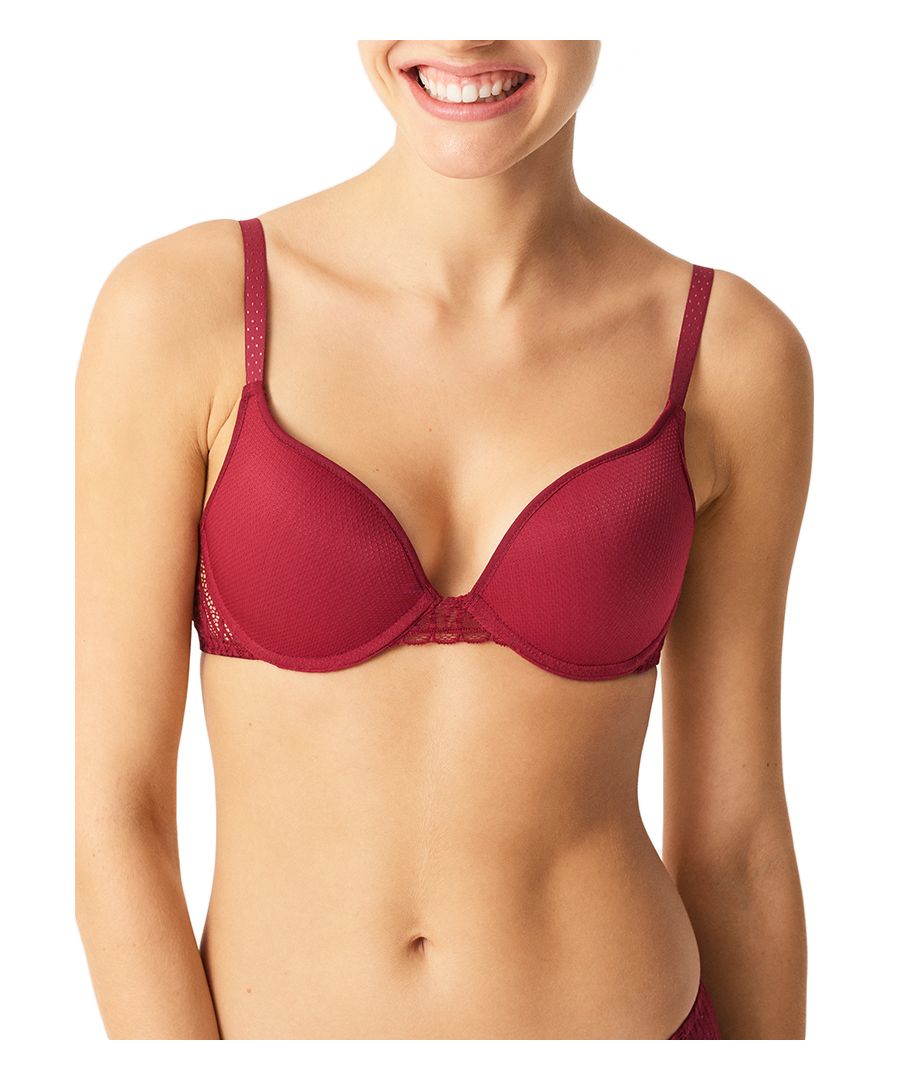 Refresh your lingerie collection with Passionata by Chantelle's Ironic. The push up bra provides extra volume to your bust with graduated padding. Underwired cups with hook and eye closure for a secure fit. Finished off with fully adjustable straps and a sheer lace detail at the center for that on-trend look.