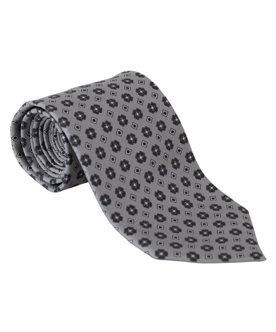 DOLCE & GABBANA\nAbsolutely stunning, 100% Authentic, brand new with tags exclusive tie. This item comes from the exclusive MainLine collection.\nColor: Gray Patterned\nMaterial: 100% Silk\nWidth: 8 cm\nMade In Italy