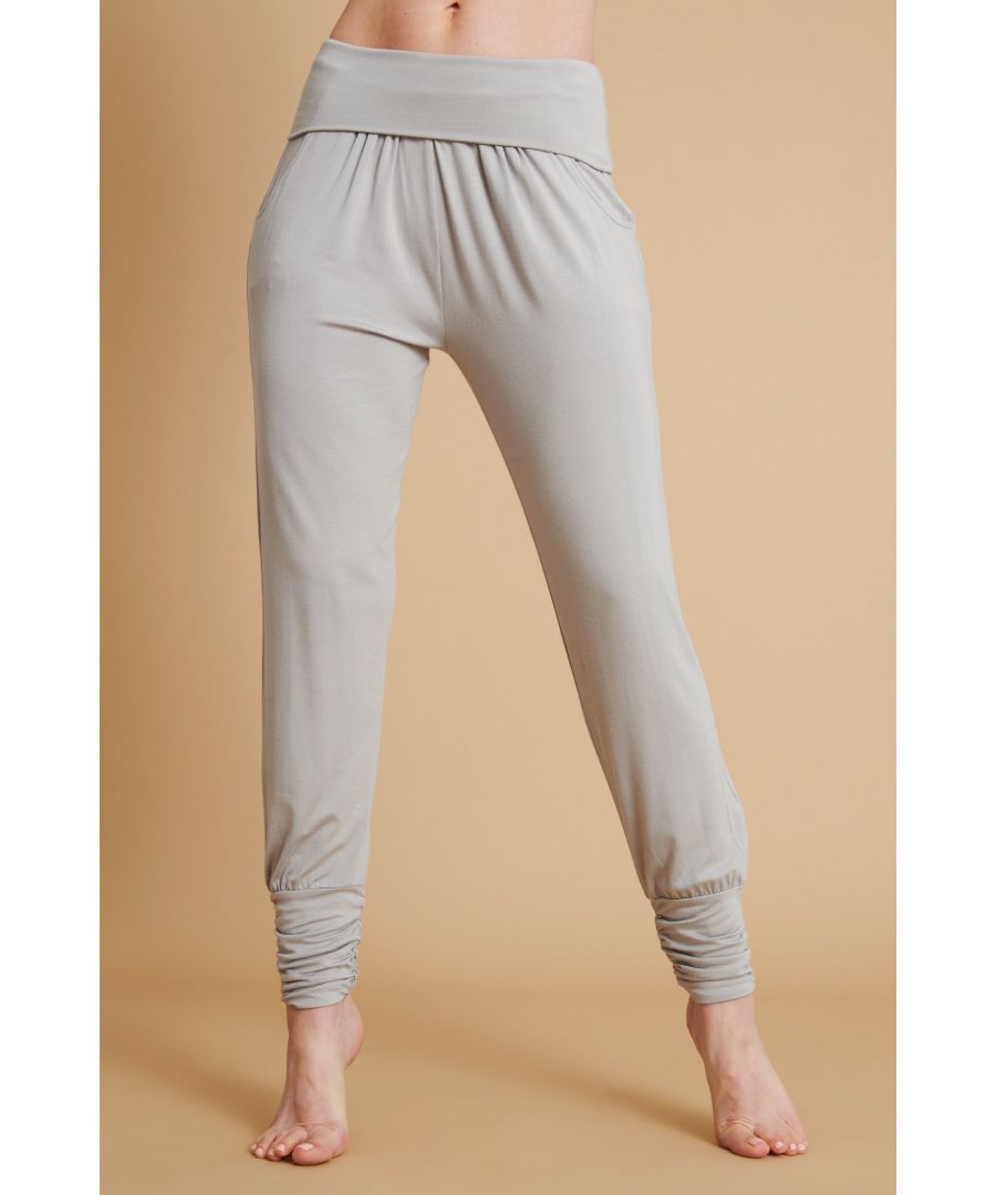 These are set to become the most useful and comfortable pants you'll own. The wide cuffs and fold down waistband mean they're staying put in even the toughest class.  \n\nDesigned for Yoga and Pilates\nMade with 95% Bamboo Viscose, 5% Elastane\n\nNaturally sweat-wicking and breathable \n\n\nFrom sustainably managed forests\n\n\nOeko-Tex certified no nasties in the dyeing process\n\n\nUnrivalled softness and great for sensitive skin\n\nWide gathered cuffs at hem \n\nRelaxed fit with tapered leg\n\nFold down waistband with soft elastic\n\nGreat for all sporting activities\n\n\nApprox Inside Leg LengthsXS - 67cms / 26.5