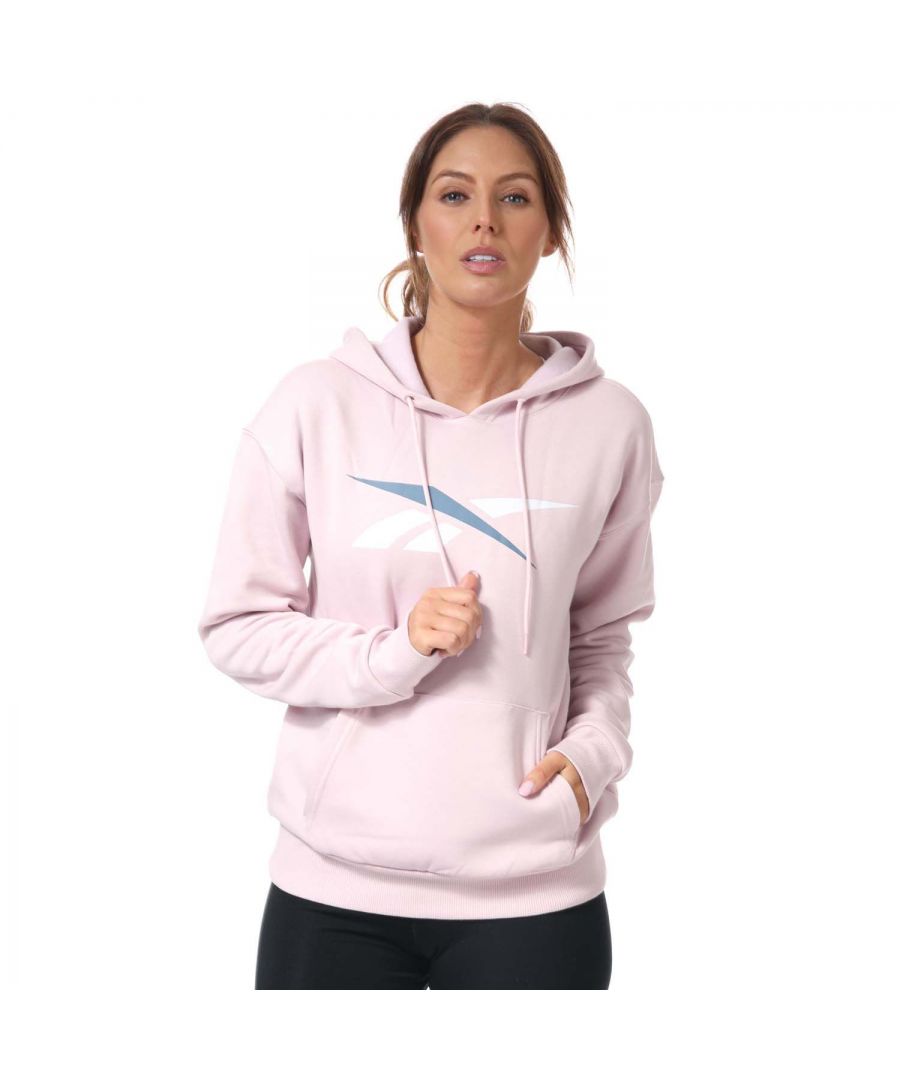 Womens Reebok Training Essentials Vector Hoody in berry.-Drawcord on hood.- Long sleeves.- Kangaroo pocket.- Ribbed cuffs and hem.- Large Vector logo on the chest.- Soft fleece fabric.- Regular fit.- Main Material: 70% Cotton  30% Polyester (Recycled). Rib Part: 95% Cotton  5% Elastane.- Ref: H62051