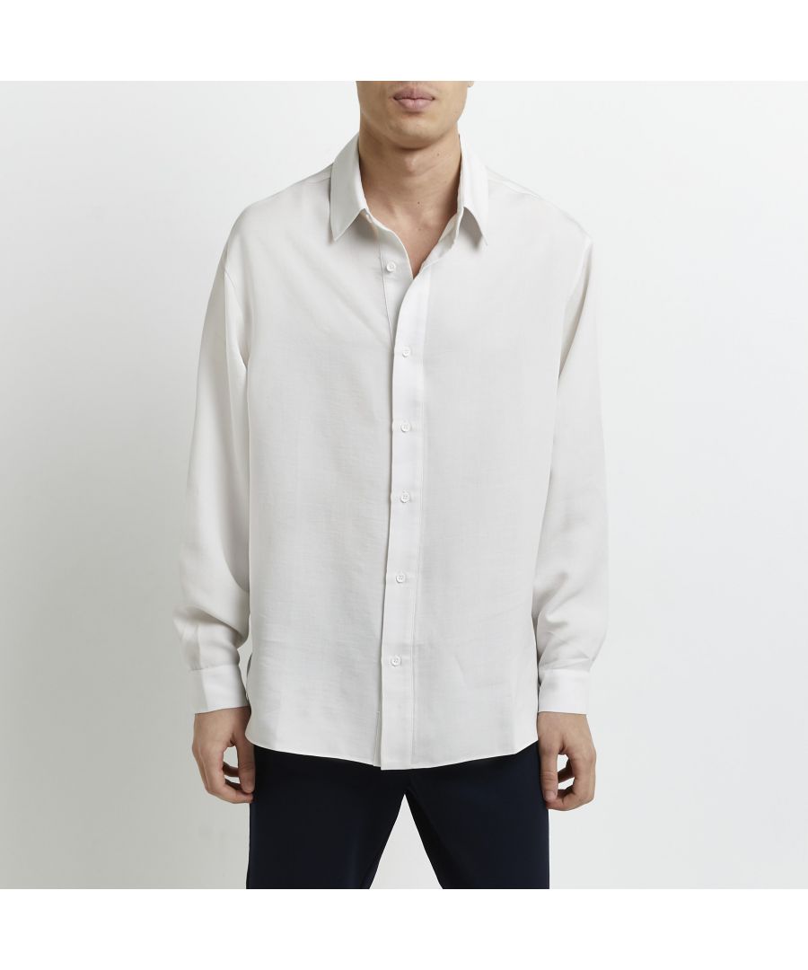 > Brand: River Island> Department: Men> Colour: Stone> Type: Button-Up> Size Type: Regular> Fit: Regular> Material Composition: 100% Viscose> Occasion: Casual> Closure: Button> Material: Viscose> Neckline: Collared> Sleeve Length: Long Sleeve> Season: SS22