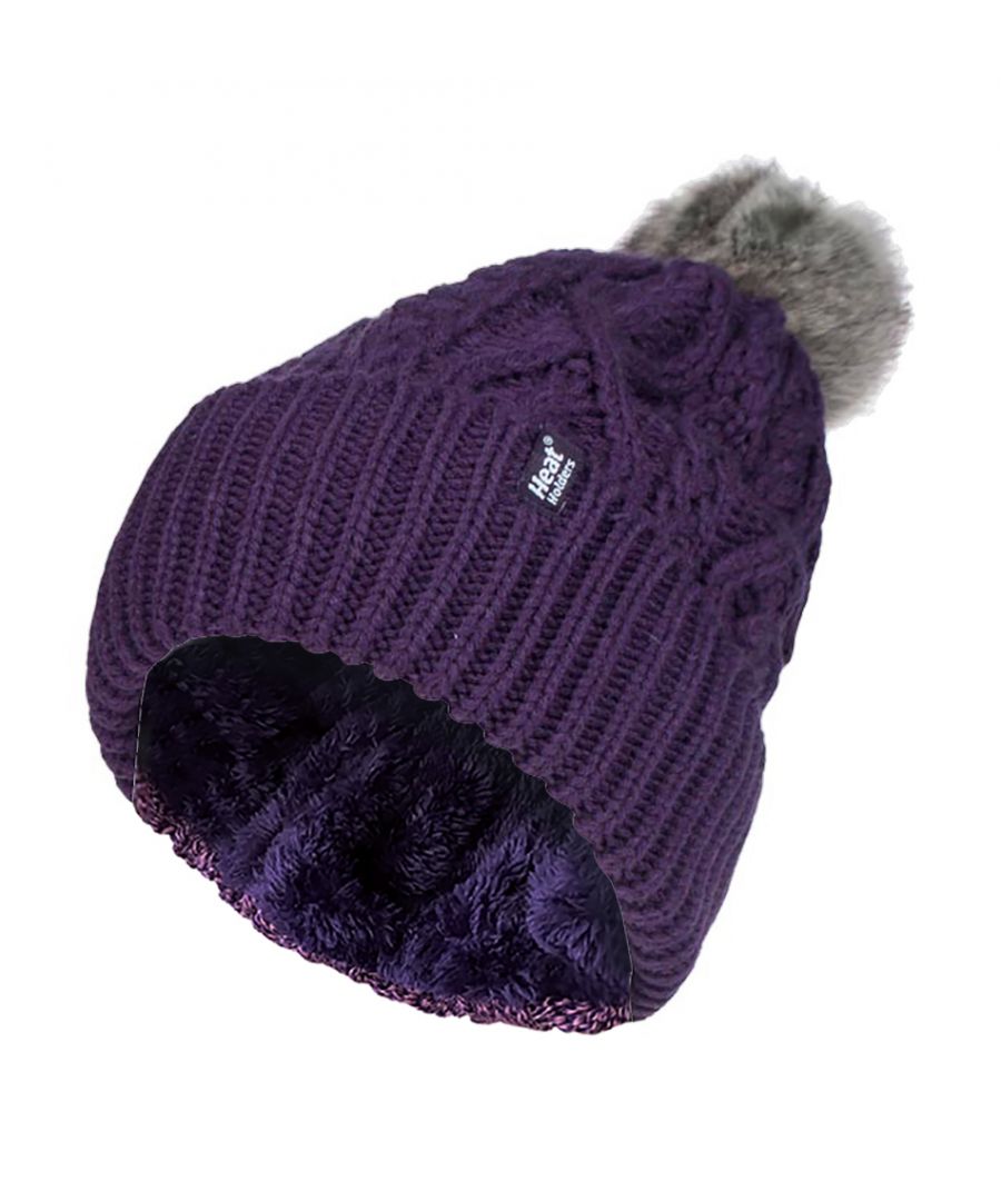 Ladies Heat Holders Solna Style Pom Pom Hat  Like the original Heat Holders ladies pom pom but with a modern styled knit, this Solna styled hat like the original aims to keep you cosy and warm whilst keeping you fashionable with their contemporary style and knit.  These womens pom pom hats have a fleece plush insulation lining, called Heatweaver, that is even more effective at holding warm air than any regular lining. This thermal lining is designed to be soft with a luxurious fleece feel (it almost feels like your touching the golden fleece) whilst holding warm air close to your skin, effectively keeping the cold air out. All of this is designed to ensure that you are toasty warm throughout the cold weather.  This pom pom hat has a turn over cuff and a large faux fur fluffy pom pom on the top of the hat. This hat has a cable knit construction on its outer to give a fashionable touch. These ladies Solna hats are also to be considered the most slouch like out of all of Heat Holders’ range of thermal hats.  These ladies Heat Holders Solna styled pom pom hats are available in 7 colours including cream, denim and light grey. They are made from 55% Polyester, 45% Acrylic on the outside of the hat and the lining is made from 100% Polyester. They come in one size and they are machine washable.  Extra Product Details  ✔ Heat Holders ✔ Heat Weaver Fleece Lining ✔ Solna Style ✔ Cable Knit ✔ Pom Pom Hat ✔ Turn Over Cuff ✔ Outer: 54% Polyester, 46% Acrylic ✔ Lining: 100% Polyester ✔ Machine Washable at 40°