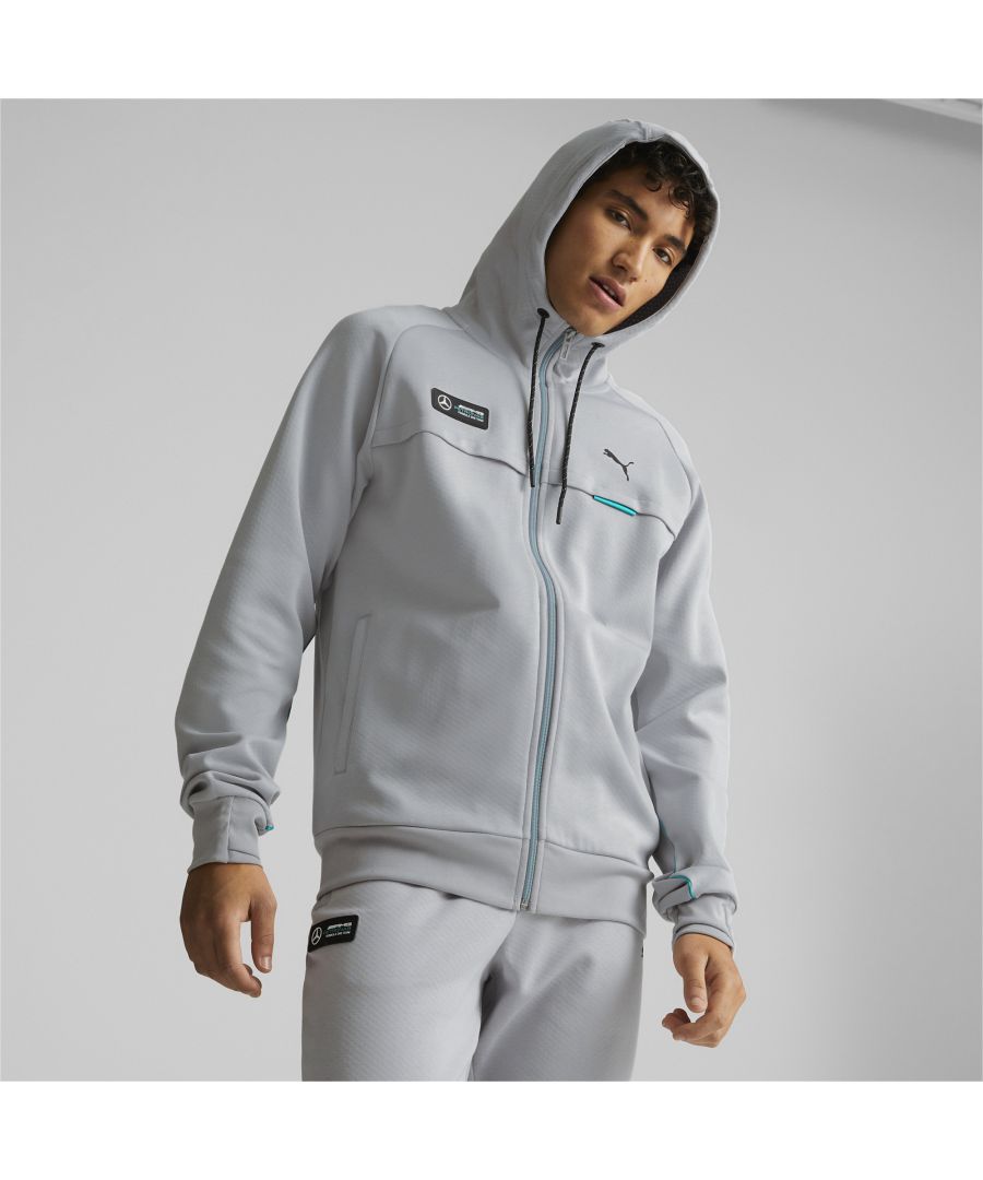 PRODUCT STORY When temperatures start to drop, throw on this handy hoodie to stay snug and stylish. The modern look is enhanced with colour-contrast details, plus slick PUMA and Mercedes-AMG Petronas Motorsport Formula One branding details, so there’ll be no doubts about who you’re backing at the race track. DETAILS Regular fitFull-zip closureHood with drawcords for an adjustable fitSide pockets for storageStructured fabric lookColour-contrast tapes, drawcords, and zipperPUMA Cat Logo on left chestMercedes-AMG Petronas Motorsport Formula One badge on right chest