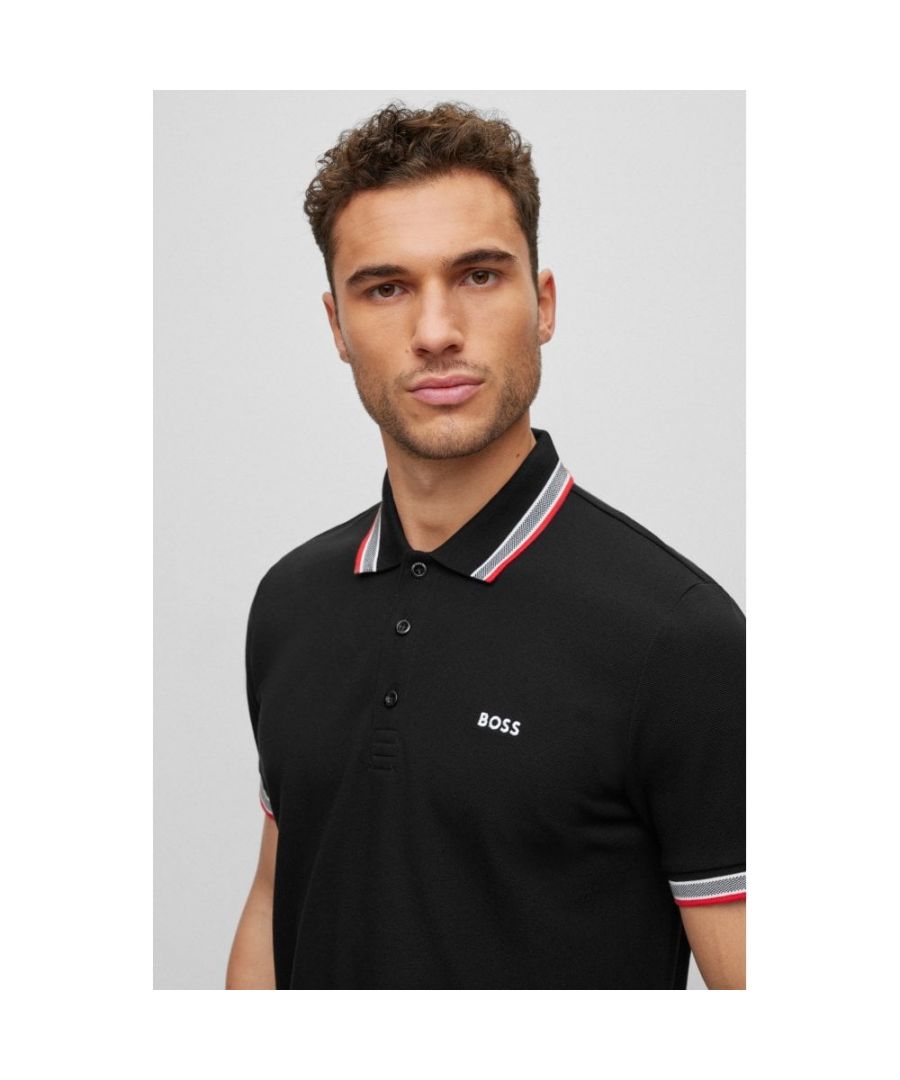 A versatile polo shirt in breathable piqué by BOSS Menswear. Designed with a curved BOSS logo at the left chest, this regular-fit polo shirt is detailed with sportive stripes and branding at the undercollar.\nRegular fitNeckline: Flat-knit collarNumber of buttons: 3Short sleevesFlat-knit cuffsStandard length\n100% Cotton\n50468983