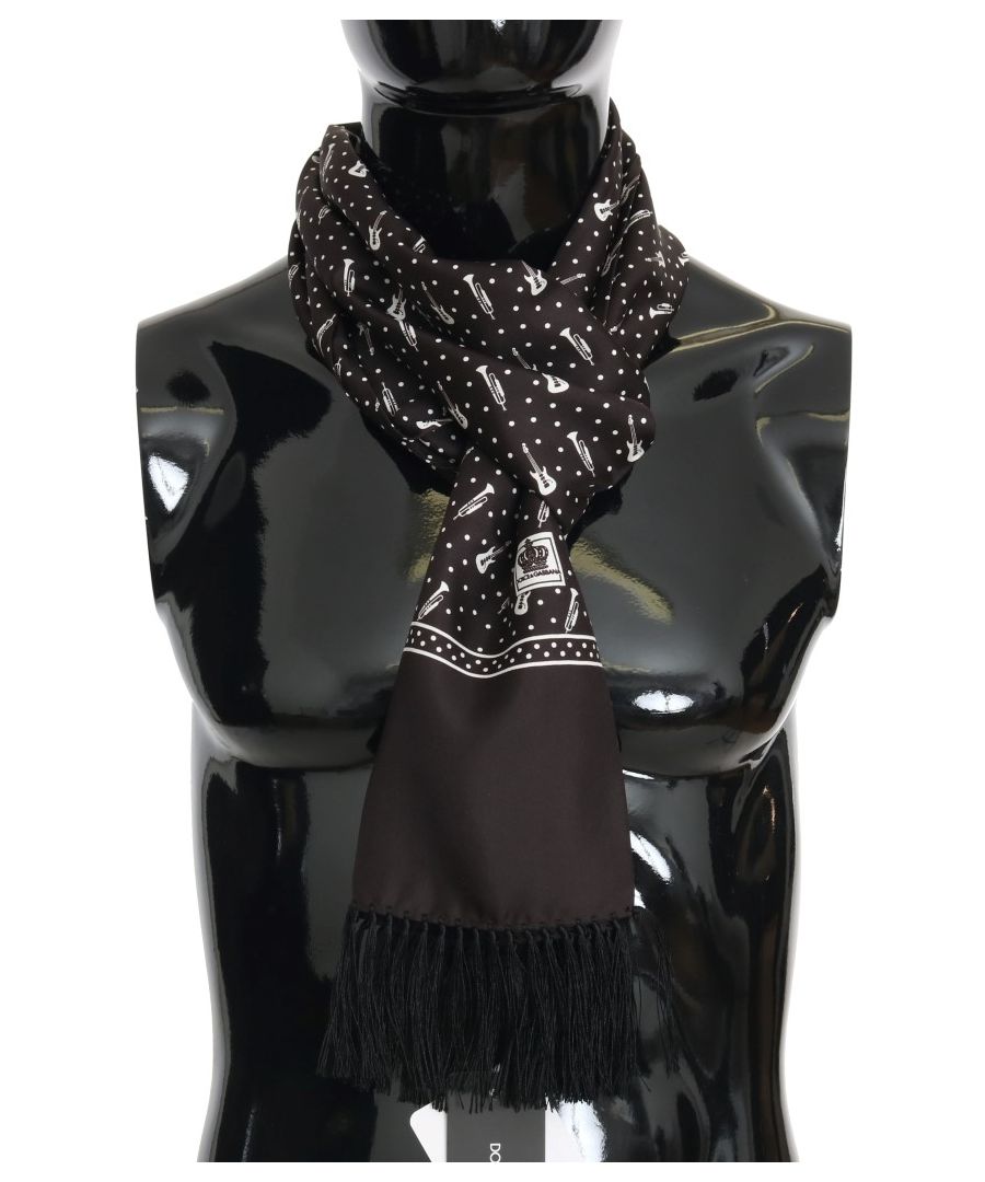 Dolce & ; Gabbana Gorgeous brand new with tags, 100% Authentic Dolce & ; Gabbana Mens scarf wrap. Matériel : 100% Silk Couleur : Brown with instrument pattern Fringes Logo details Made in Italy SIZE : 30cm x 180cm