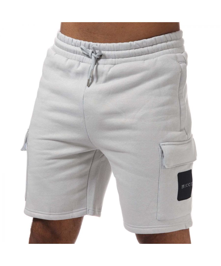 Mens NICCE Tetred Cargo Shorts in grey.- Elasticized waistband and drawcord with metal aglets.- Side seam pockets and thigh cargo pockets.- Nicce branding on left thigh pocket.- Fabric blend.- Standard fit.- 60% Cotton  40% Polyester. - Ref: 1184K0080052