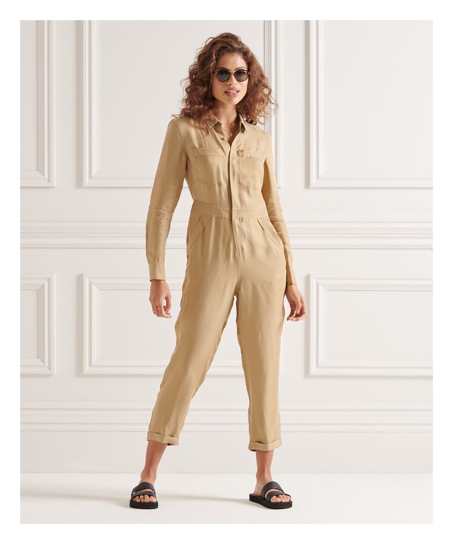 Look the part from head to toe this season with the Cupro Long Sleeved Shirt jumpsuit. Featuring a zip and button fastening, 6 pocket design, roll up cuff and a signature log tab.Slim fit – designed to fit closer to the body for a more tailored lookButton and zip fastening6 pocketsroll up cuffPopper adjustable waistSignature logo tabOur Cupro has a soft handle designed to have a silky vintage touch.