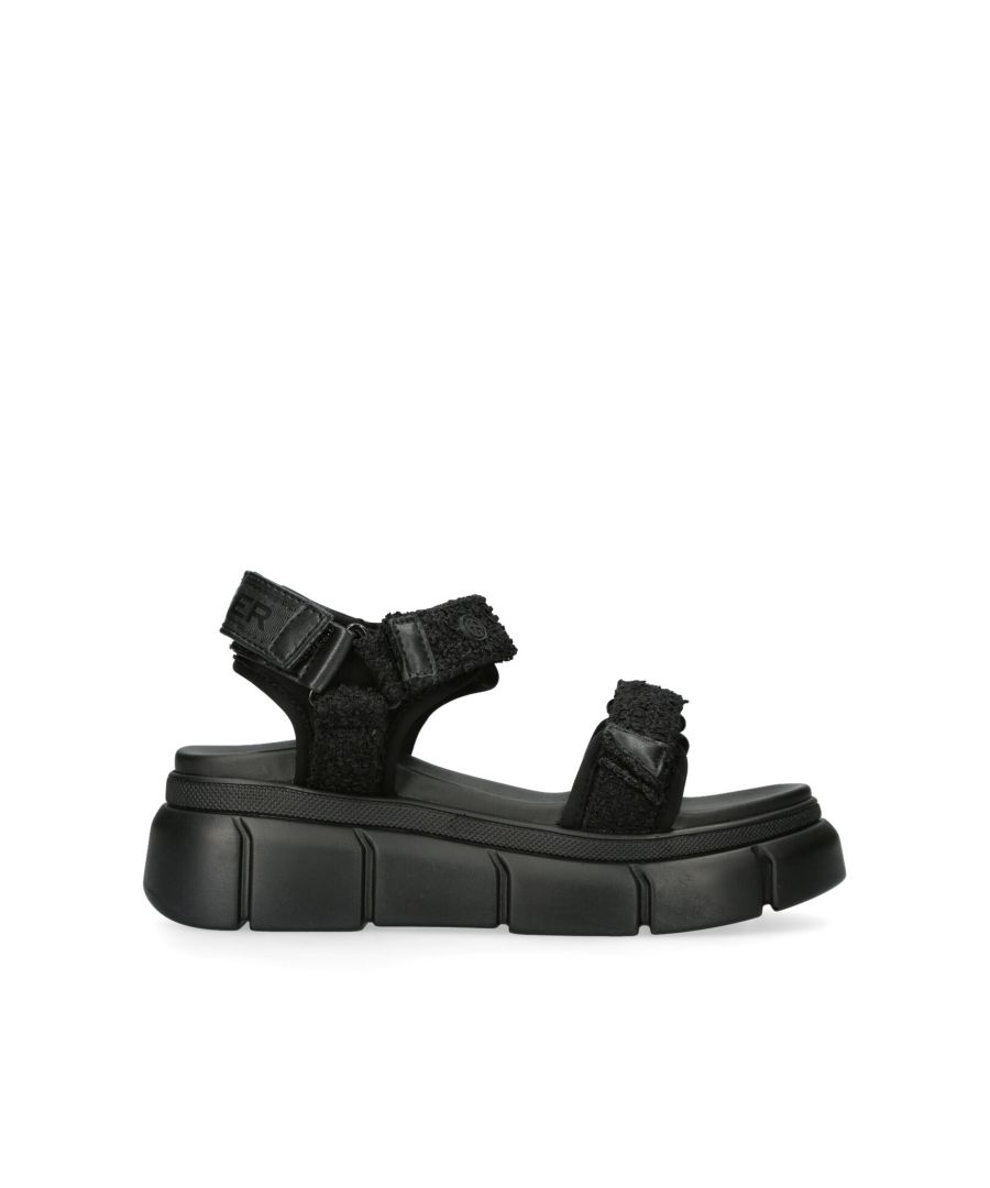 The Rigged sandals feature black tweed fabric on the velcro straps.  The back of the ankle features KG Kurt Geiger logo printed on ribbed textile with a print stitch detailing tape. Sole height: 4cm. This product is registered with The Vegan Society.