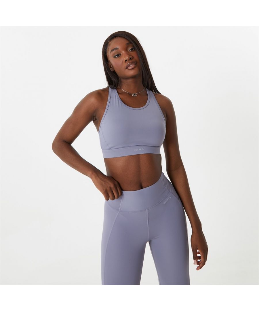 Let your modern sportswear take centre stage with this sports bra. Designed with racer back, scoop neckline, stretch elasticated underband and wicking sweat away whilst keeping you dry, so there’s nothing standing in the way of you and your workout. This medium support bra is perfect for cardio, weight-lifting, cycling and other medium impact sports. This will be sure to bring your athleisure up a notch. Sweat it out and keep cool in the USA Pro. Please note: Style may vary  >Sweat wicking  >Pro-dry  >Built-in bra  >Mid support  >Original styles: 90% Polyamide and 10% Elastane  >New styles: 78% Polyester and 22% Elastane  >Power mesh: 88% Polyester and 25% Elastane  >Machine washable