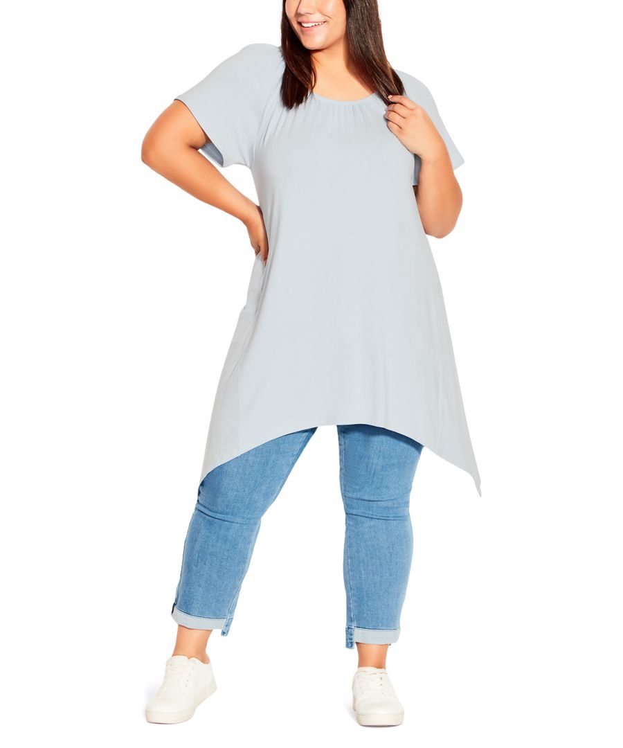 We're loving the casual and relaxed flair of the Hanky Hem Plain Tunic. Perfect for the weekends, this style is finished with a round elasticated neckline, optional off shoulder sleeves and breathable soft stretch fabrication. Key Features Include: - Round elasticated neckline - On/off shoulder flutter sleeve - Soft stretch fabrication - Relaxed silhouette - Handkerchief hemline Layer this top with a cardigan and mom jeans.