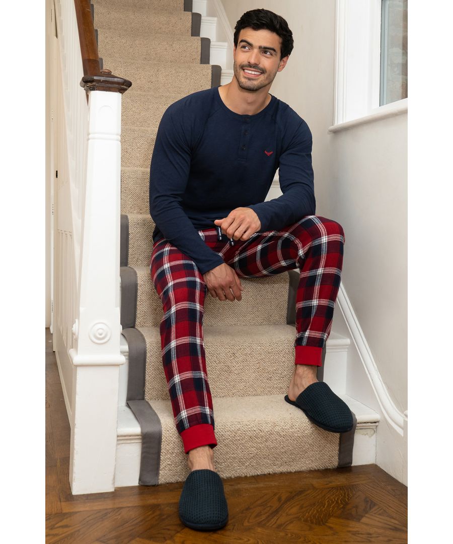 This cotton loungewear set from Threadbare includes a long sleeve top with grandad collar and check flannel bottoms with two side pockets. The bottoms have elasticated cuffs and waistband with drawstring for extra comfort. Made from a soft fabric to ensure a comfortable feel and easy washing, this set is perfect for lounging at home or bedtime. Other designs available.