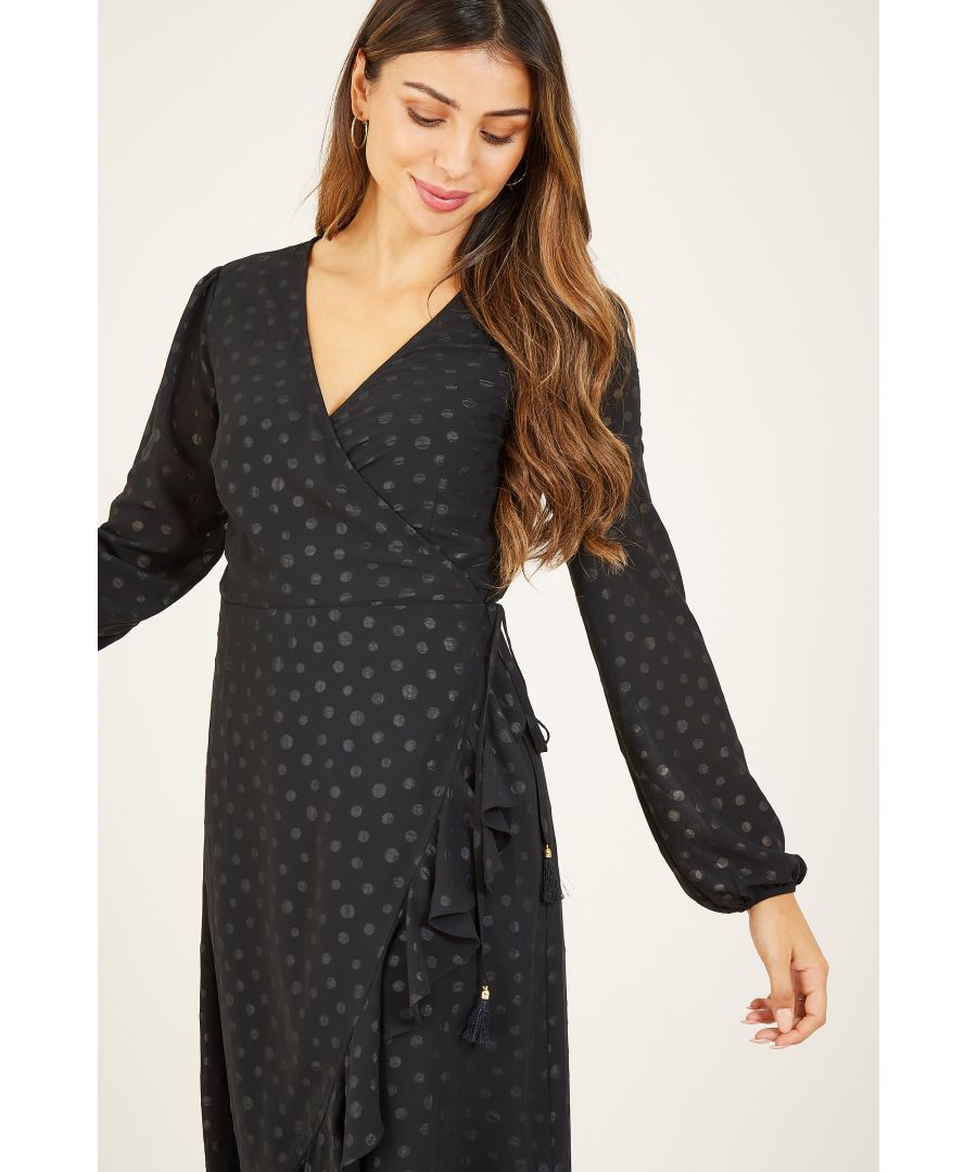 Find the perfect frill this season with our swish-worthy Yumi Spotted Frill Wrap Dress. Made from light and flippy fabric detailed with a subtle polka dot print, it's enhanced by gentle frills running from the tie waist to the hemilne. Long sleeves make it the ultimate evening go-to - wear with heels for dressed up events, or with trainers for dressed down days.  100% Polyester Machine Wash At 30 Length is 105CM