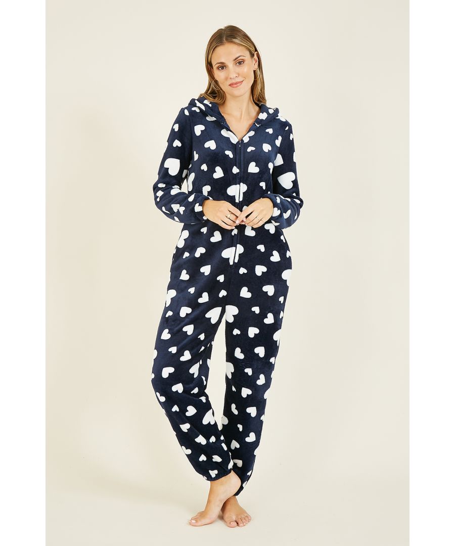 All-in-one's just got cuter. Cuddle up on the sofa in this Yumi Navy Heart Super Soft Onesie With Pockets - the luxury loungewear you've been looking for. Impossibly soft and comfy, with a zip fastening and cosy hood.