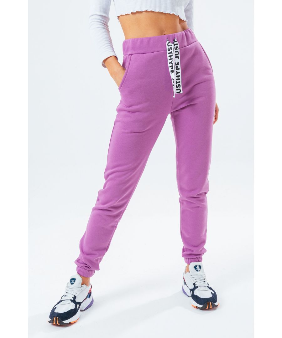 The HYPE. Lilac Drawstring Women's Joggers are perfectly matched with the HYPE. Lilac Drawstring Women's Hoodie to complete the look. Or opt for a cute contrasting white body suit. Designed in 80% cotton and 20% polyester for an unreal amount of comfort. With an elasticated waistband and woven embossed drawstrings, these essential joggers are the perfect addition to your jogger 'drobe. Machine wash at 30 degrees.