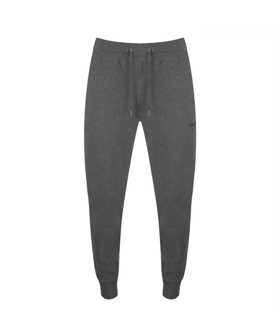 <h2>Firetrap Slim Joggers</h2>\nKeep things casual with the Slim Joggers from Firetrap. Crafted with an adjustable drawstring waist and 2 zip pockets. The look is completed with the Firetrap branding.\n\n> Men's Joggers\n> Adjustable Drawstring Waist\n> Elasticated Trims\n> 2 Zip Pockets\n> Rubber Logo\n> Firetrap Branding\n> 80% Cotton, 20% Polyester\n> Keep Away From Fire