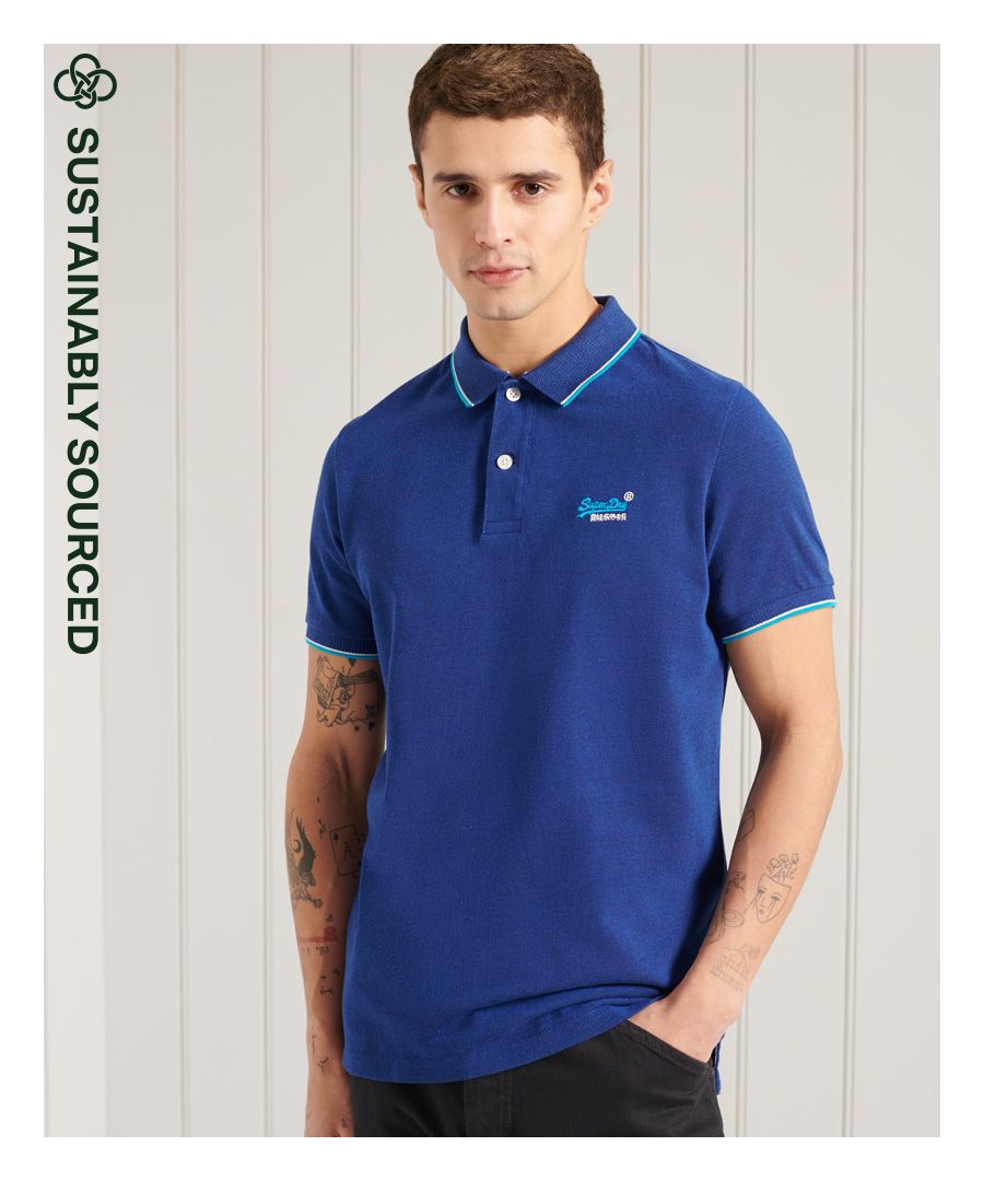 Superdry men's Poolside pique polo shirt. Relax your style this season with a classic polo shirt featuring short sleeves, a button up collar, side split on the seams, and a longer hem at the back. Pair with jeans for a casual look, or chinos for a smarter look.Slim fit – designed to fit closer to the body for a more tailored look