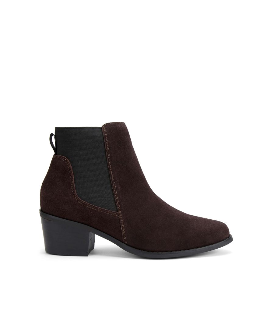 The Spider ankle boot features a brown suede upper. The toe is softly rounded with a black rubber heel. Heel height: 3cm.