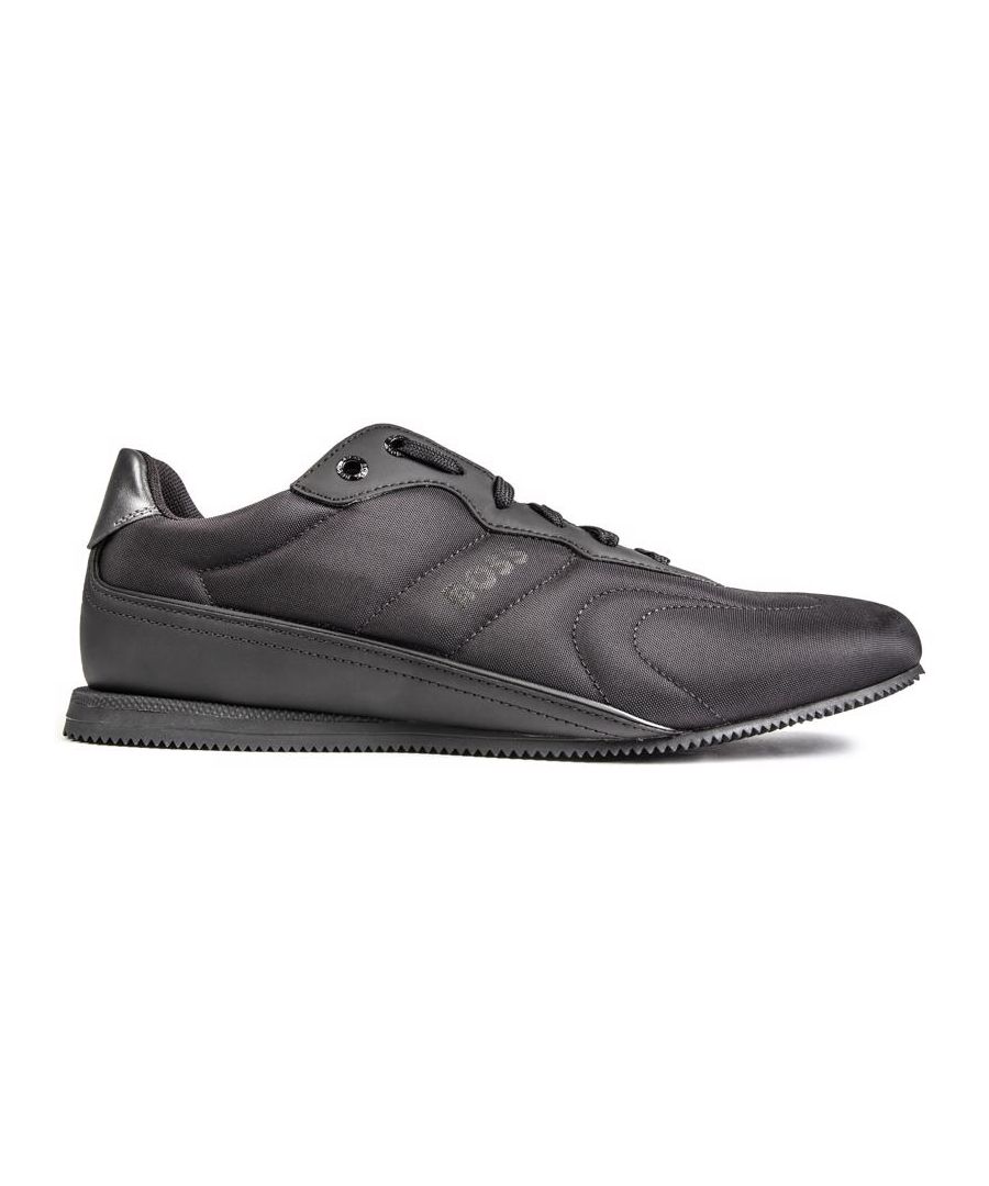 The All In Black Rusham Low Trainer From Designer Boss Is Stylish Crafted In High Quality Nylon, With A Low Profile Sole And Signature Branding. These Designer Shoes Feature Branded Metal Eyelets And Padded Collar And Tongue. The Mono Details Keep Things Luxe, While The Sleek Details Ensure You Make Your Mark Wherever You Go.