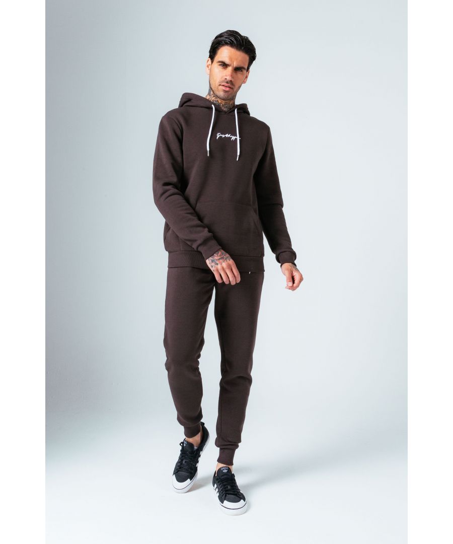 The Hype Brown With White Signature Script Men'S Hoodie & Jogger Set is your new go-to loungewear set when you need that extra comfort boost. Designed in 80% Cotton 20% Polyester for the ultimate soft touch feeling! The Hoodie features a fixed hood, kangaroo pocket, fitted hem and cuffs, finished with contrasting white pullers and embossed justhype embroidery across the front. The Joggers highlight an elasticated waistband, fitted cuffs and double pockets with contrasting white pullers and embossed justhype embroidery on the side of the leg. Wear together or stand alone with a pair of box fresh kicks. Machine washable. 
